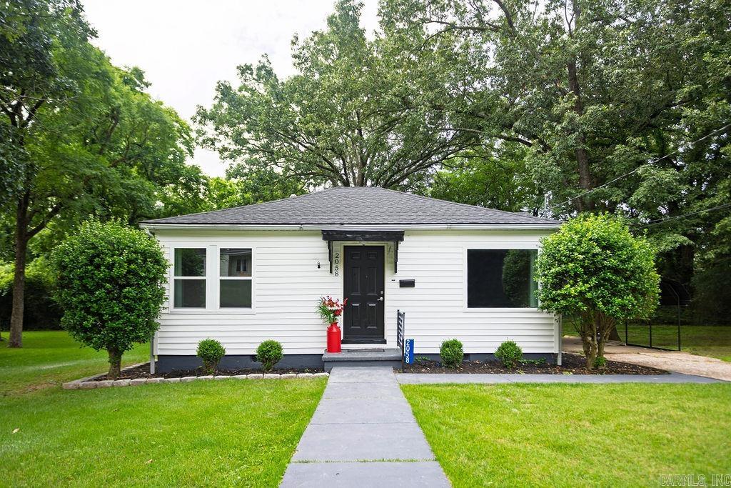 Just a stone's throw from Lyon College, this adorable cottage has been beautifully remodeled and is ready for its next chapter. Fresh paint, new luxury vinyl plank flooring, updated windows, and a stylish kitchen featuring stainless steel appliances give this home a fresh, modern feel. The bathroom has been tastefully updated with trendy tile finishes that add character and charm.  Whether you're a first-time homebuyer, looking to downsize, or searching for the perfect short-term rental opportunity, this property checks all the boxes. With its unbeatable location and move-in-ready updates, this little gem offers endless possibilities!