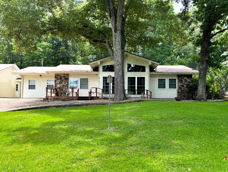 3 Bedroom House on One Level / Deached 3 Car Garage - This beautiful home is one level and offers 3 bedrooms, 2 baths, living room, spacious kitchen, with a nice dining area, and stone tile floors. Architectural shingles that are 4 years old, septic is 2 years old, H/AC unit is 4 years old. Nice 3 car garage detached but very accessible from the house. Backyard with with many great gardening options and a patio. All of this is located directly across the street from the North Golf Course so you are easily cart distance to the first Tee.