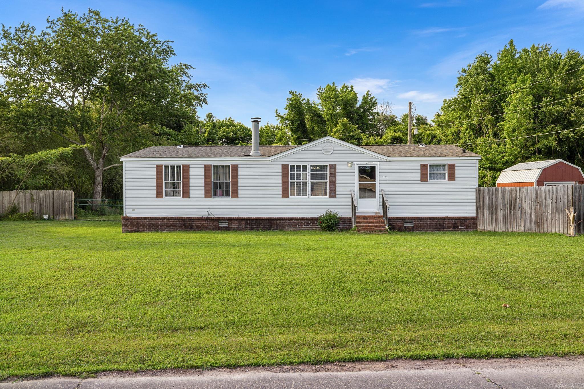 Welcome to Bayou Meto Place! This 3 bedroom, 2 bathroom home offers the perfect blend of peaceful country living and subdivision charm, nestled outside city limits in one of the area’s quiet, established neighborhoods. The oversized backyard is a standout feature, ideal for entertaining, gardening, or simply enjoying the wide-open space that country living affords. A brand new 2025 shed adds excellent storage, and the 2026 hot water heater means one less thing to worry about for years to come. Security and convenience are covered with gate access on both driveways, plus a dedicated parking pad beyond the right gate. Plenty of room for vehicles, trailers, or recreational equipment. Priced to sell, this property is a fantastic opportunity whether you’re a first-time homebuyer ready to put down roots or an investor looking for strong potential. Don’t miss your chance to own in Bayou Meto Place!