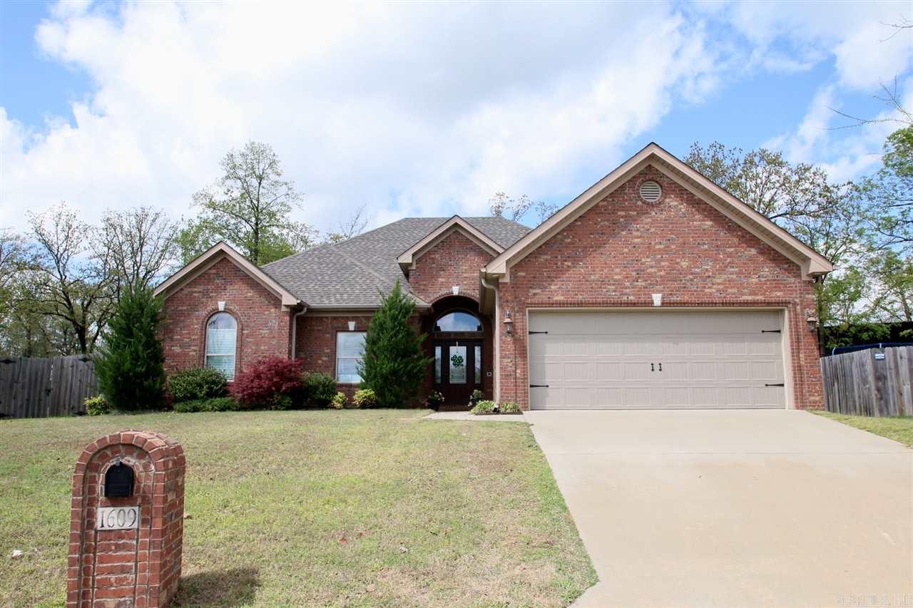 Open and airy one level home with split floor plan. The eat in kitchen is open to the cozy living room with great fireplace. The huge master bedroom and bath are off of the main living area with the other bedrooms down the hall on the other side of the house.  The room laundry area allows for lots of space when you enter the home from the two car garage. The large foyer is very welcoming and allow lots of light into the main living areas. The completely fenced yard gives lots of room for play and/or pet.