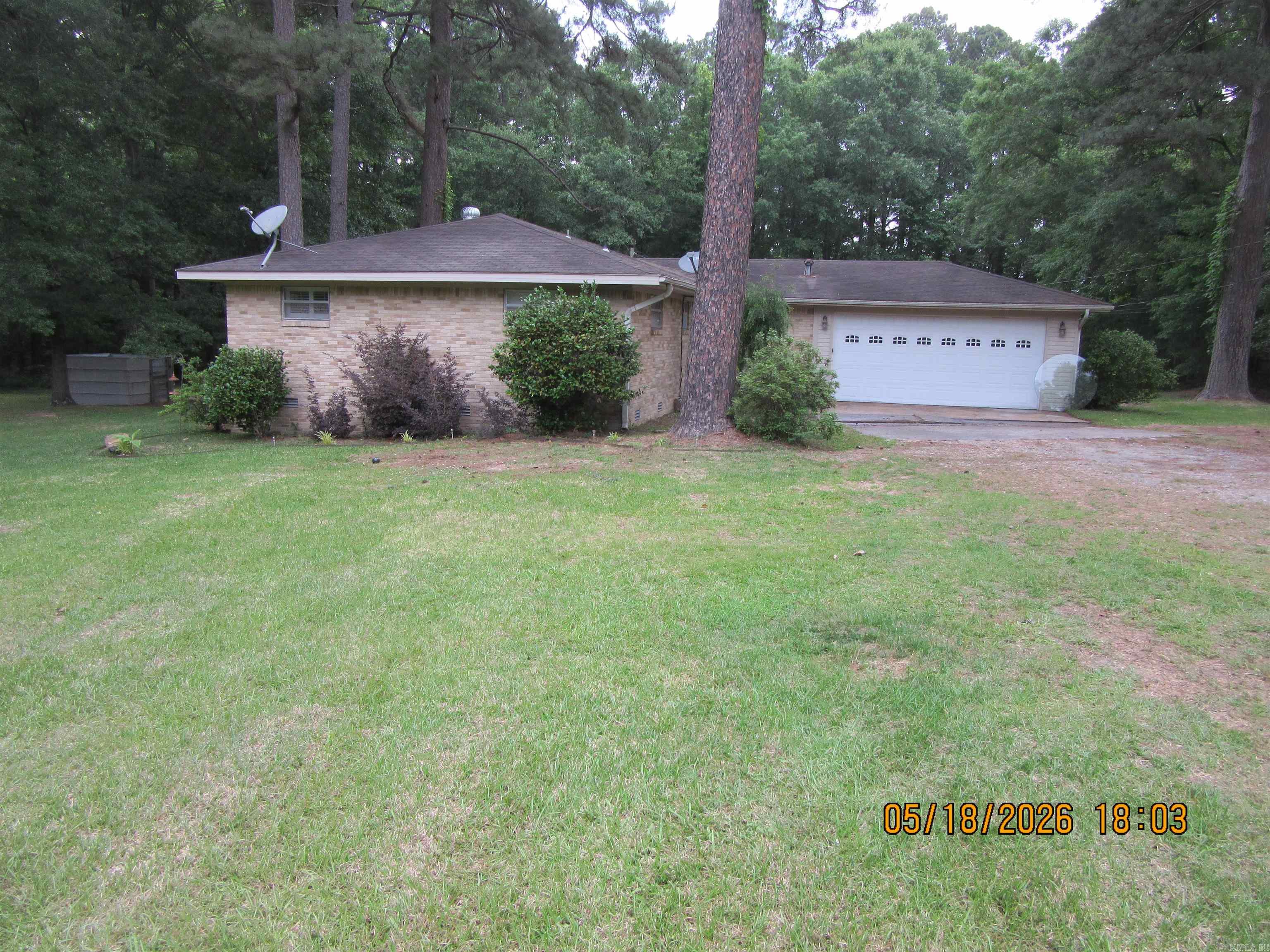 Well maintained brick home and 2 acres just outside city limits. Updates include kitchen, flooring, fireplace, and handicapped design shower in master bath and much more. Also included is a 20x20 shop that is wired and lean to storage. Wood deck in back yard for parties or just relaxing.