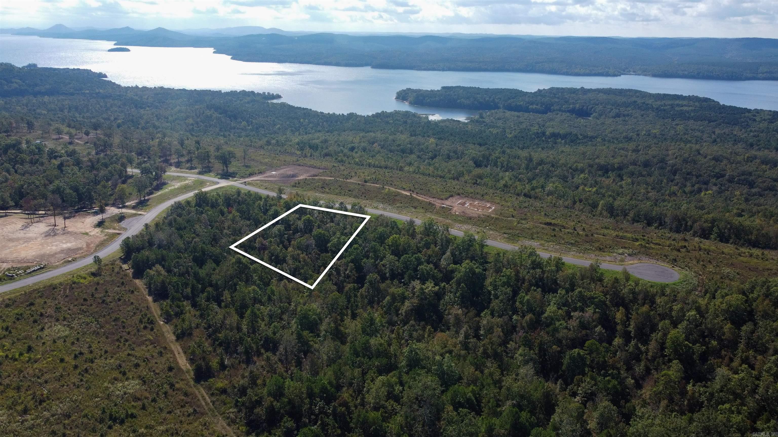Lakeview West highlights the enchanting beauty of Arkansas, presenting an incredible opportunity for outdoor enthusiasts. This 0.91-acre lot backs up to scenic walking and biking trails, providing easy access to nature right from your doorstep. Enjoy panoramic views of the majestic mountains and expansive skies, making it the perfect setting to build your dream home. Take advantage of this chance to create your ideal living space in such a picturesque environment!