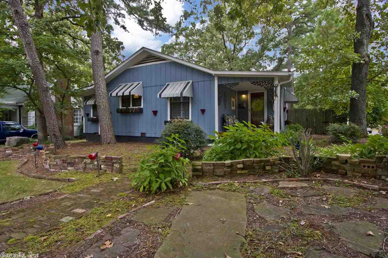 The quintessential Hillcrest home with lots of character & charm!  This home sits on an oversized corner lot with rear alley access to 2 car carport.  Commercial style eat in kitchen with Vulcan 6 burner gas stove, separate dining room space that opens into living room, remodeled bath, & 3 bedrooms with nice hdwd floors throughout.  Other updates include new HVAC, newer roof, new gutters, new insulation and flooring installed in attic.  Fully fenced & landscaped yard.