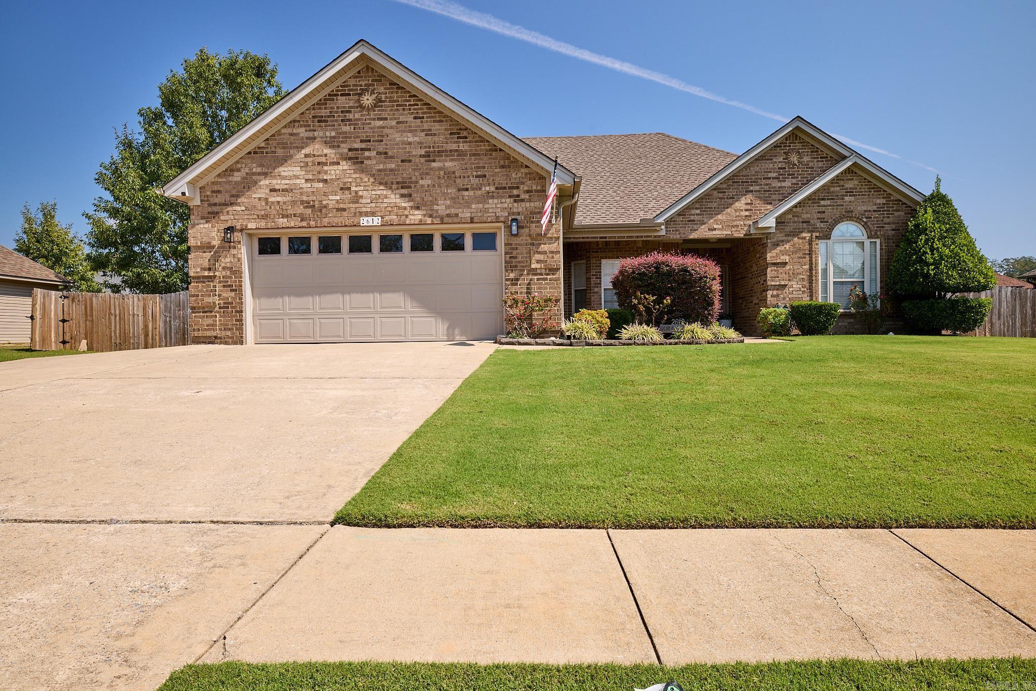 Welcome to this inviting home in the Coldwater Creek subdivision! Offering 3 bedrooms, 2 full baths, and approximately 1,828 square feet, built in 2007, this home features a well-designed split floorplan that provides added privacy between the primary suite and secondary bedrooms. The spacious family room is a great gathering space, complete with a gas-starter fireplace for cozy evenings. The eat-in kitchen includes a gas range and double ovens—ideal for cooking and hosting.  The primary suite features a tray ceiling, walk-in closet, and an ensuite bath with double sinks and a walk-in shower. Enjoy outdoor living on a lot just under a quarter acre, featuring a fully fenced backyard and a covered patio—perfect for relaxing or entertaining.