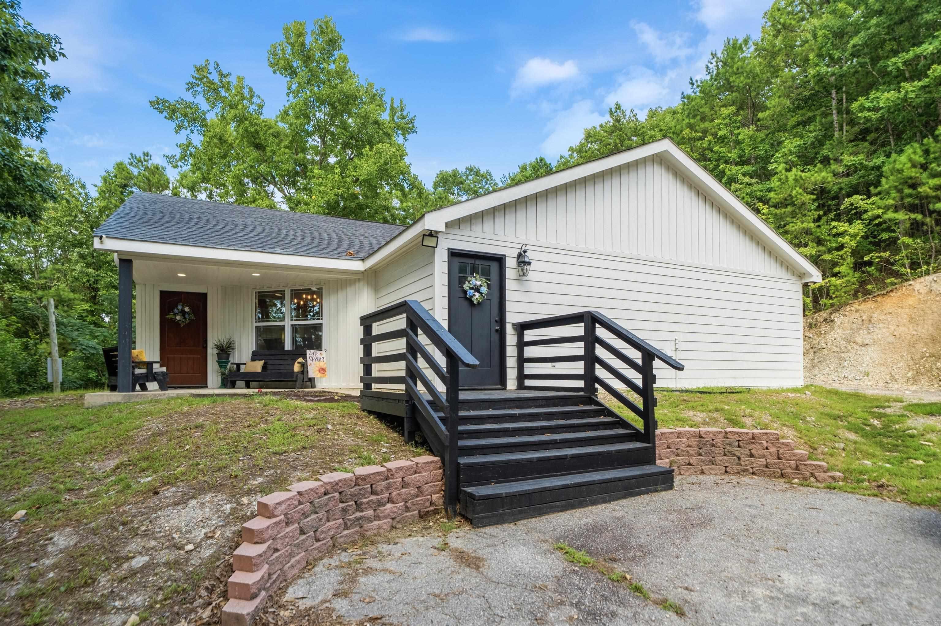 A place to get away from it all! This beautiful 3BR 2 Full Bath and 2 half bath home is a hidden gem. Located on 4.98 acres, this is the place to find peace and tranquility. Enjoy nature from the front or back porch and this fall will pop with the changing of the leaves.   Living room features plenty of room and 3 large windows overlooking the mature trees and vista views. The kitchen boasts a country style with all the amenities of a modern kitchen including a pot filler faucet at the stove. Just off the dining area is the laundry room that is also big enough for a home office or craft room.   Each bedroom has its own bathroom connected and the primary bedroom has an extra large wall-in closet and bathroom that makes you appreciate the builder.    Like to hunt? Seller is leaving a tree stand and feeder for this year’s deer season. Plenty of storage inside and 2 extra storage building outside convey with the property. There is also a partially finished tree house that could be completed at minimal cost. This is the place you’ve been looking for.