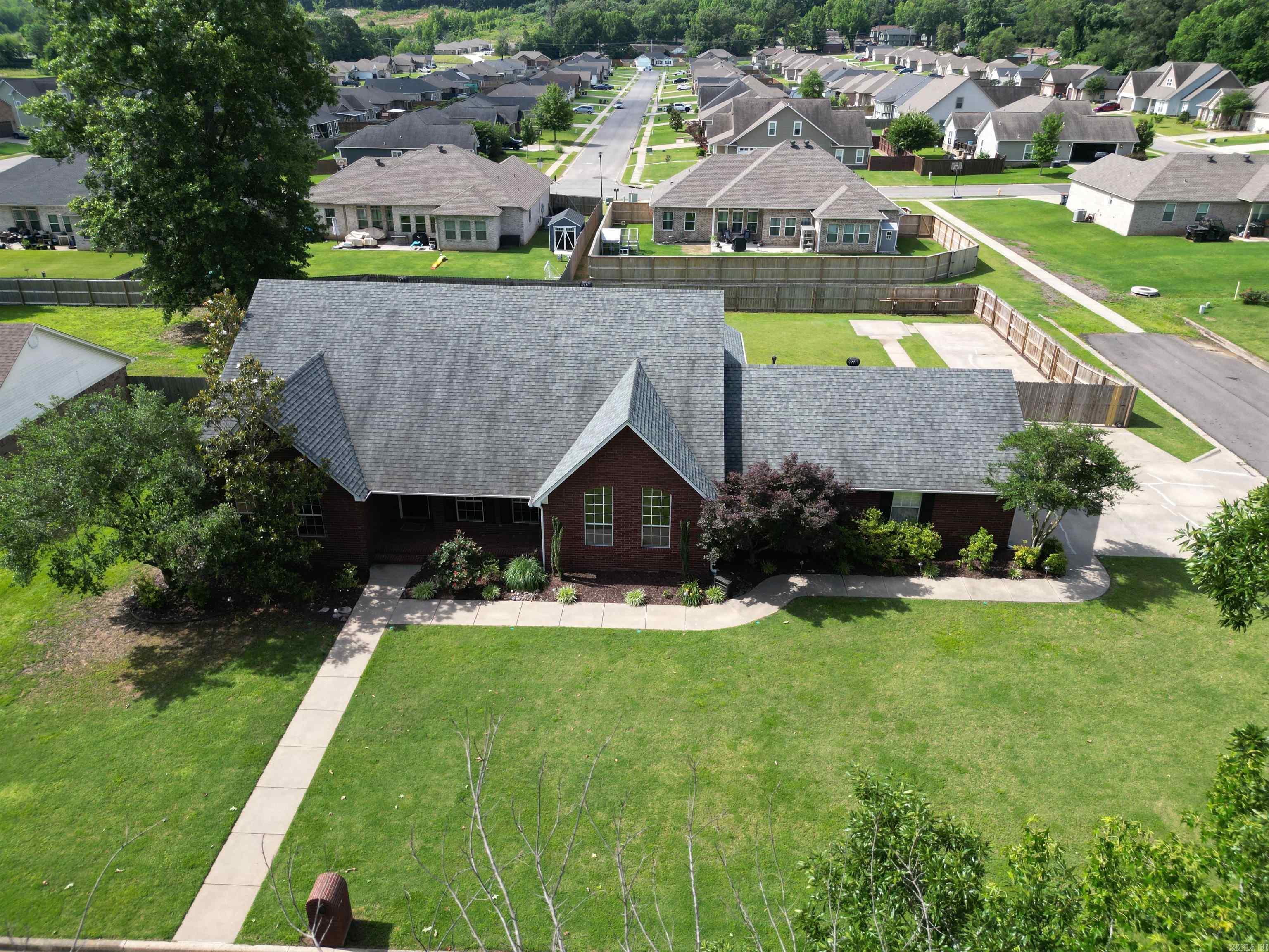 Discover the perfect blend of space, functionality, and comfort in this beautiful 4-bedroom, 3-bath home located in desirable West Russellville. Situated on a corner lot, this well-designed home features two primary suites, offering flexibility for multi-generational living, guests, or added privacy. Step inside to find tall ceilings throughout, creating an open and inviting atmosphere. The versatile fourth bedroom can easily serve as a home office, study, or hobby room to fit your needs. Storage is abundant throughout the home, providing plenty of space to keep everything organized. Outside, you'll appreciate the dedicated RV parking pad, offering convenient off-street parking boat or extra vehicles. A fire hydrant located in the yard may also provide potential insurance benefits. The corner lot adds curb appeal and extra outdoor space, making this property practical & attractive. If you're looking for a spacious home with a ample storage, and a sought-after West Russellville location, this one is a must-see!