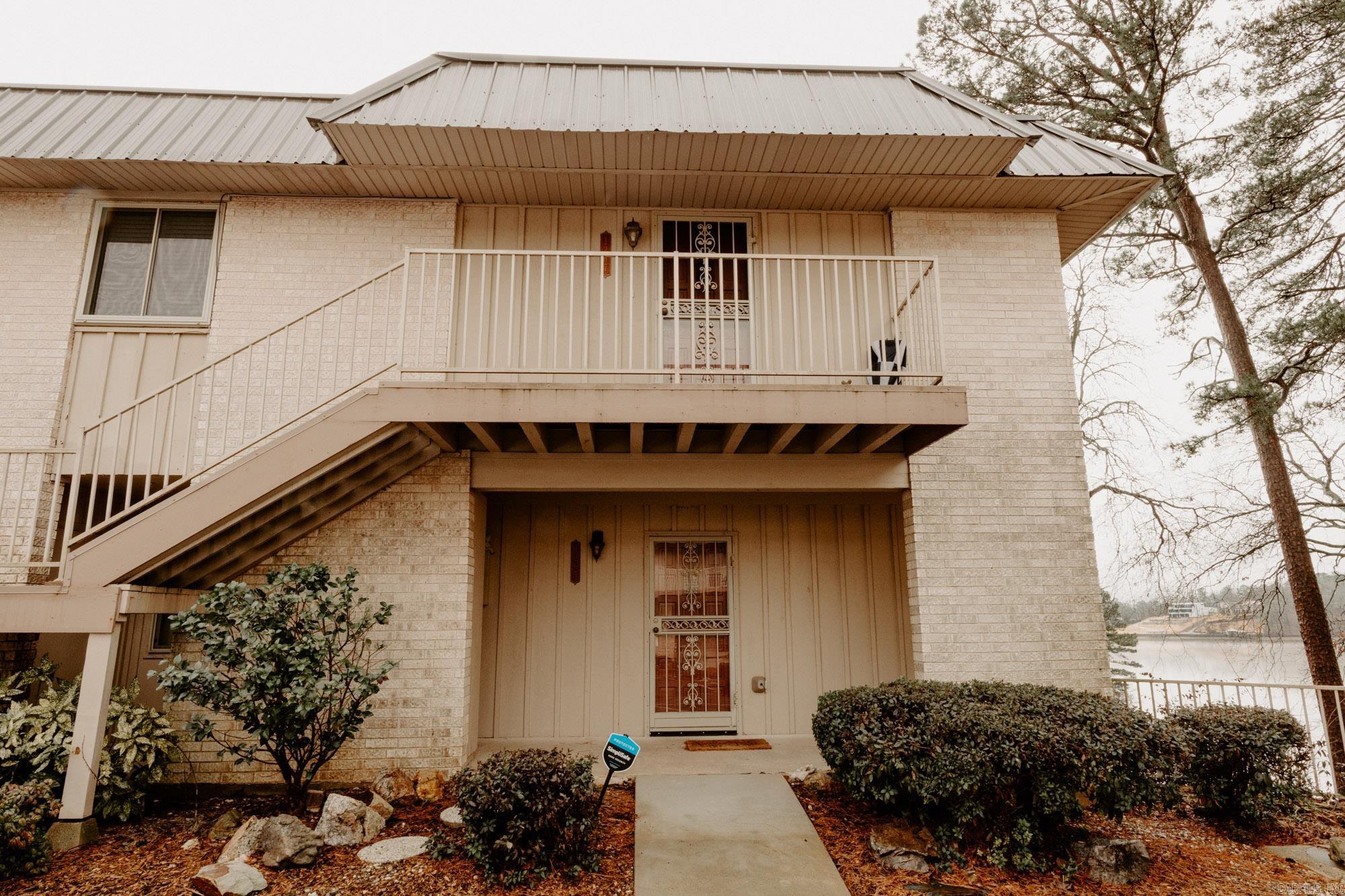 This 2-bedroom and 2-bath condo could be your next investment or your own getaway to Lake Hamilton just minutes away from Central Avenue. Located just off Higdon Ferry. Roof was just replaced this past Summer. Complex allows quarterly rentals in this private gated community. Home is coming to the next buyer fully furnished. Beds, refrigerator, decorations on the wall, living and dining rooms furniture and outdoor furniture that overlooks Lake Hamilton. You'll have a boat slip and complex has a community room and swimming pool at the point overlooking the lake. SEE AGENT REMARKS