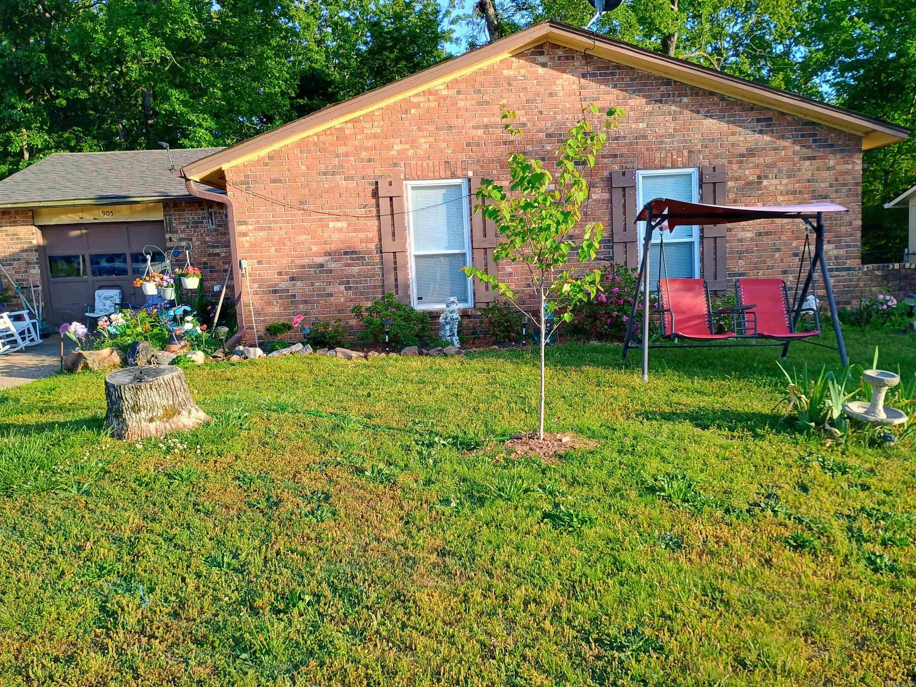 This home would make a great starter home or an ideal option for a retired couple. Featuring 3 bedrooms and 1.5 baths, the property offers a brick and wainscot exterior with central heat and air, city water, and city sewer.  Inside, you’ll find a vaulted ceiling in the living and dining area, laminate and carpeted flooring, and a sliding glass door that opens to a nice, fenced backyard—perfect for relaxing or entertaining. The stove, refrigerator, and dishwasher will convey with an accepted offer.  Priced to sell—call today to schedule your showing!