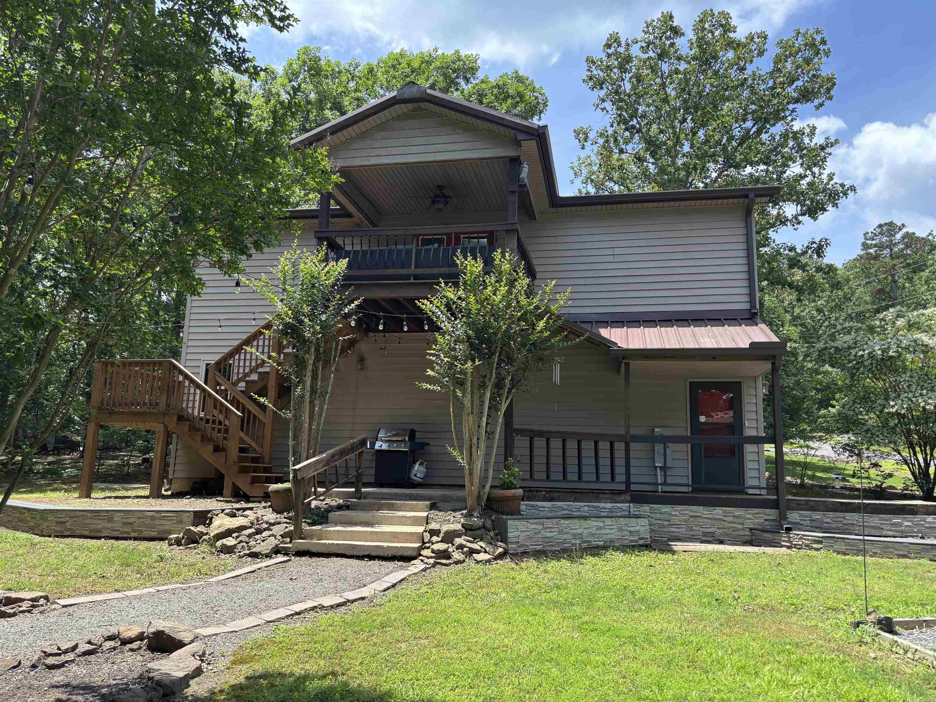 Enjoy being at your own Lake Home!  This property features 3bdrm, 2full baths! Spending time with you family & friends with this open floor plan making memories! Cabin look and feel with log like walls & wood ceilings (with a mixture of sheetrock)!  Masterbedroom gives privacy from kids & company! Huge attached garage for 2 cars, atv's or fisning boat then step out the front door to your nice detached 16x32 shop! Features a 12ft garage door and tall ceilings for pontoon storage.  Also has another small storage area for extra storage! Drive just down the street to neighborhood boat launch!  Homeowners have maintained this property superior! Great property!
