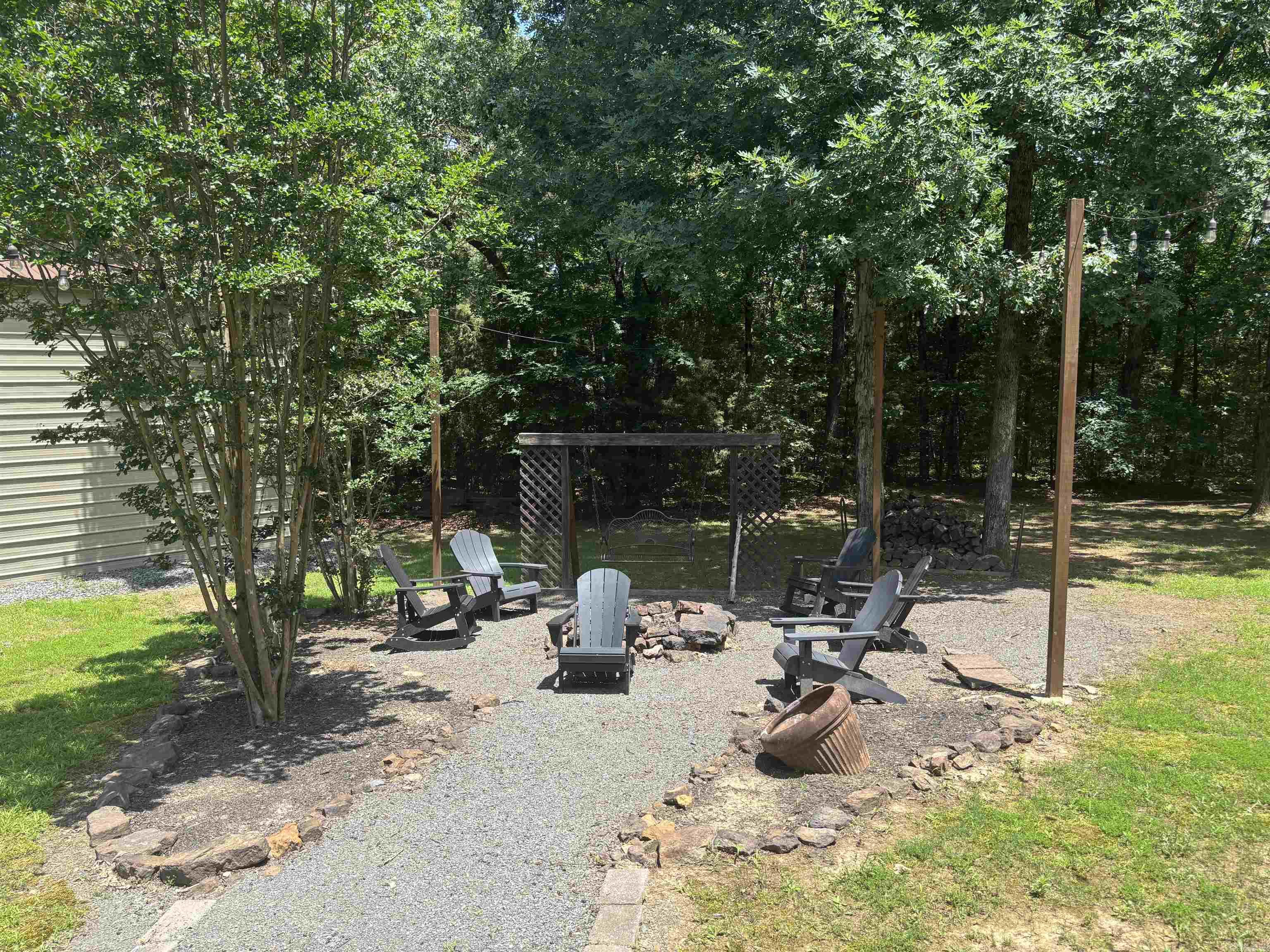 Enjoy being at your own Lake Home!  This property features 3bdrm, 2full baths! Spending time with you family & friends with this open floor plan making memories! Cabin look and feel with log like walls & wood ceilings (with a mixture of sheetrock)!  Masterbedroom gives privacy from kids & company! Huge attached garage for 2 cars, atv's or fisning boat then step out the front door to your nice detached 16x32 shop! Features a 12ft garage door and tall ceilings for pontoon storage.  Also has another small storage area for extra storage! Drive just down the street to neighborhood boat launch!  Homeowners have maintained this property superior! Great property!