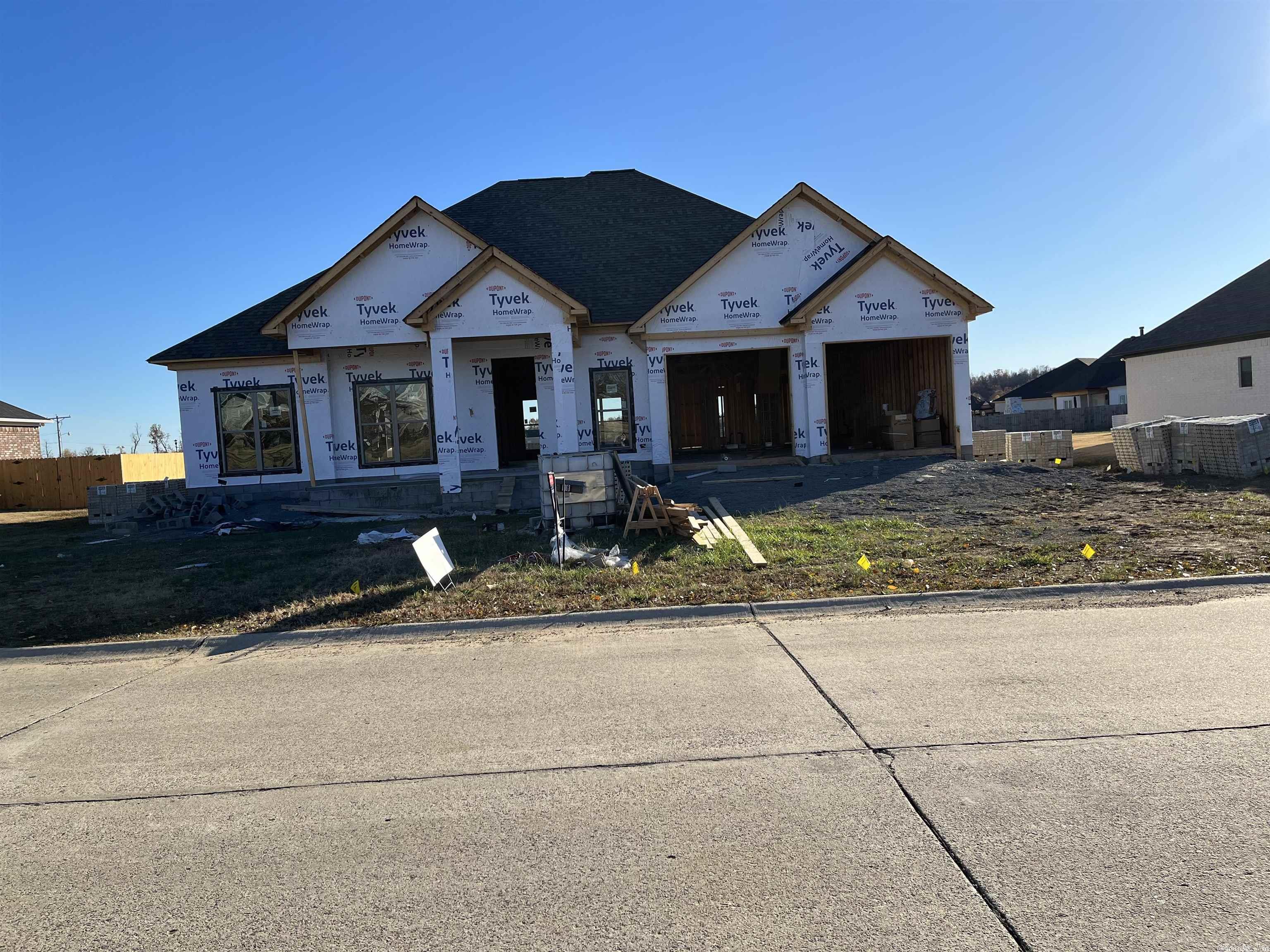Very energy efficient. Custom finishes throughout. 10 ft ceilings with crown in main areas. Custom cabinets, granite throughout. Stained concrete floors thru out. Tankless water heater, gas & tv hook-ups on back porch. Utility sink in laundry and garage. Agents see docs and agent remarks.
