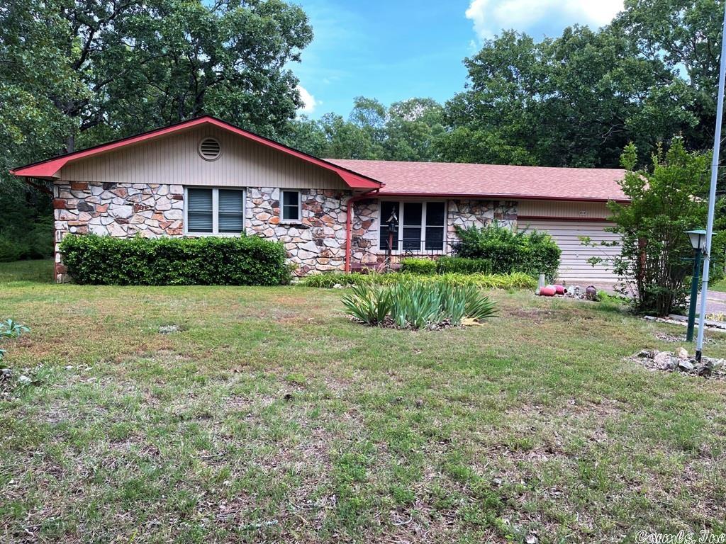 Looking for a nice 3 bed/2 bath home close to all amenities? Here it is! The property is on a level lot with a large backyard. There is a lovely patio on the back of the house with a view, perfect for morning coffee. Dishwasher is included. In addition to the 2 car garage, (which has storage room in back and a workbench), there is a 7x10 Metal Storage Building for the extras you may have.