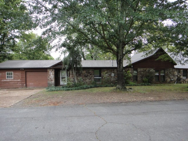 Rock and frame home with easy access to downtown. Spacious backyard.  SEE AGENT REMARKS ON HOW AND WHERE TO SUBMIT OFFERS.