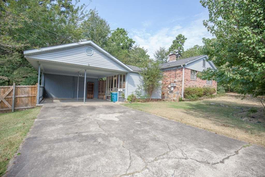 WONDERFUL THREE BEDROOM HOME, HARDWOOD FLOORS, WOODBURNING FIREPLACE, TWO CAR CARPORT.  LARGE WOODED DECK, FENCED-IN YARD.  PELLA WINDOWS. LOCKBOX ON CARPORT DOOR.