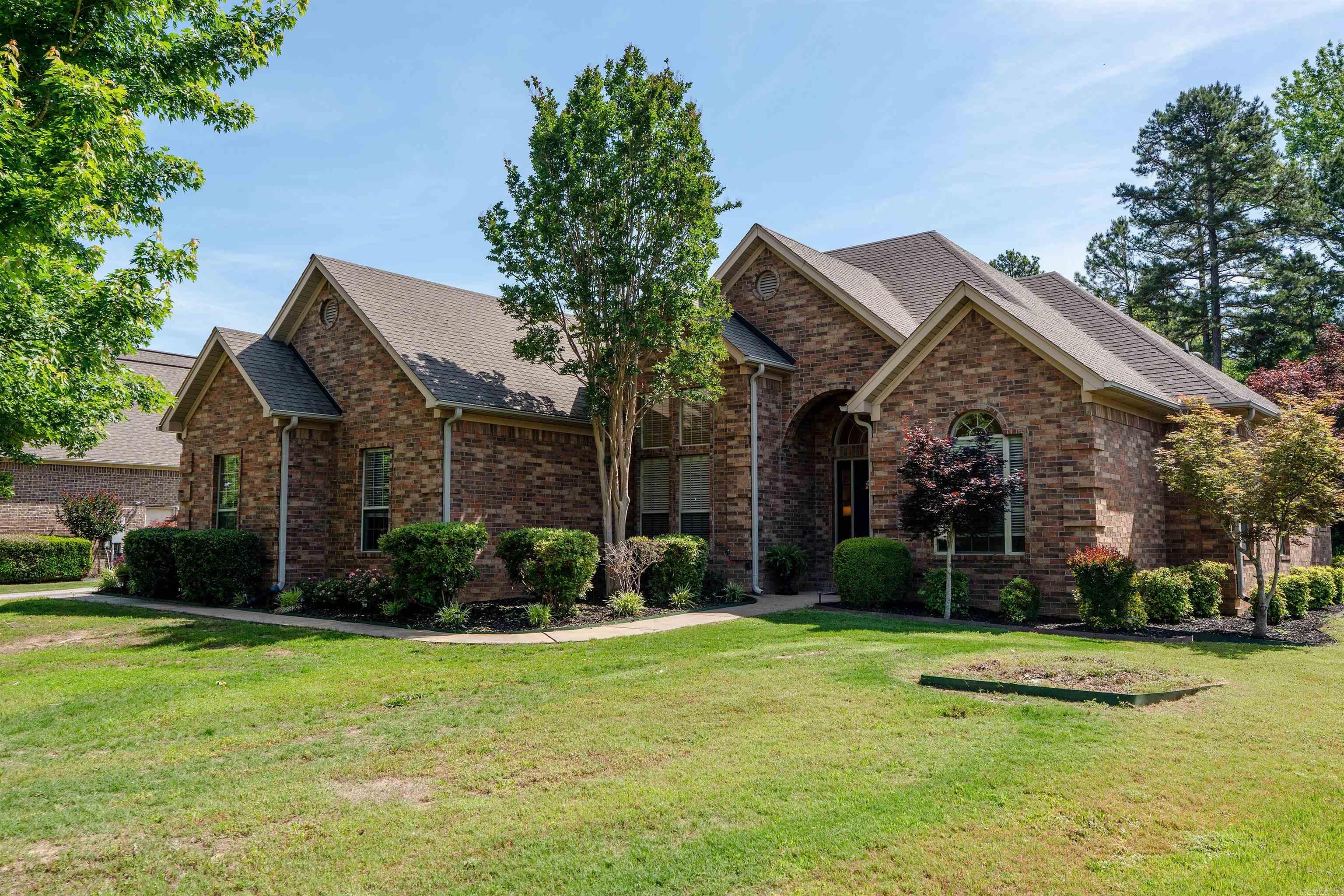 A Must-See home in the heart of Heber Springs offering space, gorgeous updates, and an unbeatable location near Greers Ferry Lake and the Little Red River! This well-maintained 3 bedroom 2.5 bath home features approximately 1800 sq ft of gorgeous living space plus an impressive detached garage conversion adding nearly 575 sq ft of heated and cooled flexible bonus space. Currently used as an entertainment/workout room with its own half bath, this area would make a great game room, hobby space, office, or guest overflow area. Inside the main home, you will enter to high ceilings, hardwood floors throughout the common areas, and fresh light paint giving it a welcoming feel. The open living, dining, and bonus room are perfect for entertaining. The kitchen features an eat-in bar, separate breakfast area, and pantry. The laundry room complete with new designer tile floor completes the interior with style and function. Step outside to your private backyard patio overlooking a wooded lot that can be purchased separately for added privacy, expansion potential, or investment opportunity. Homes like this do not last long. Schedule your tour today!