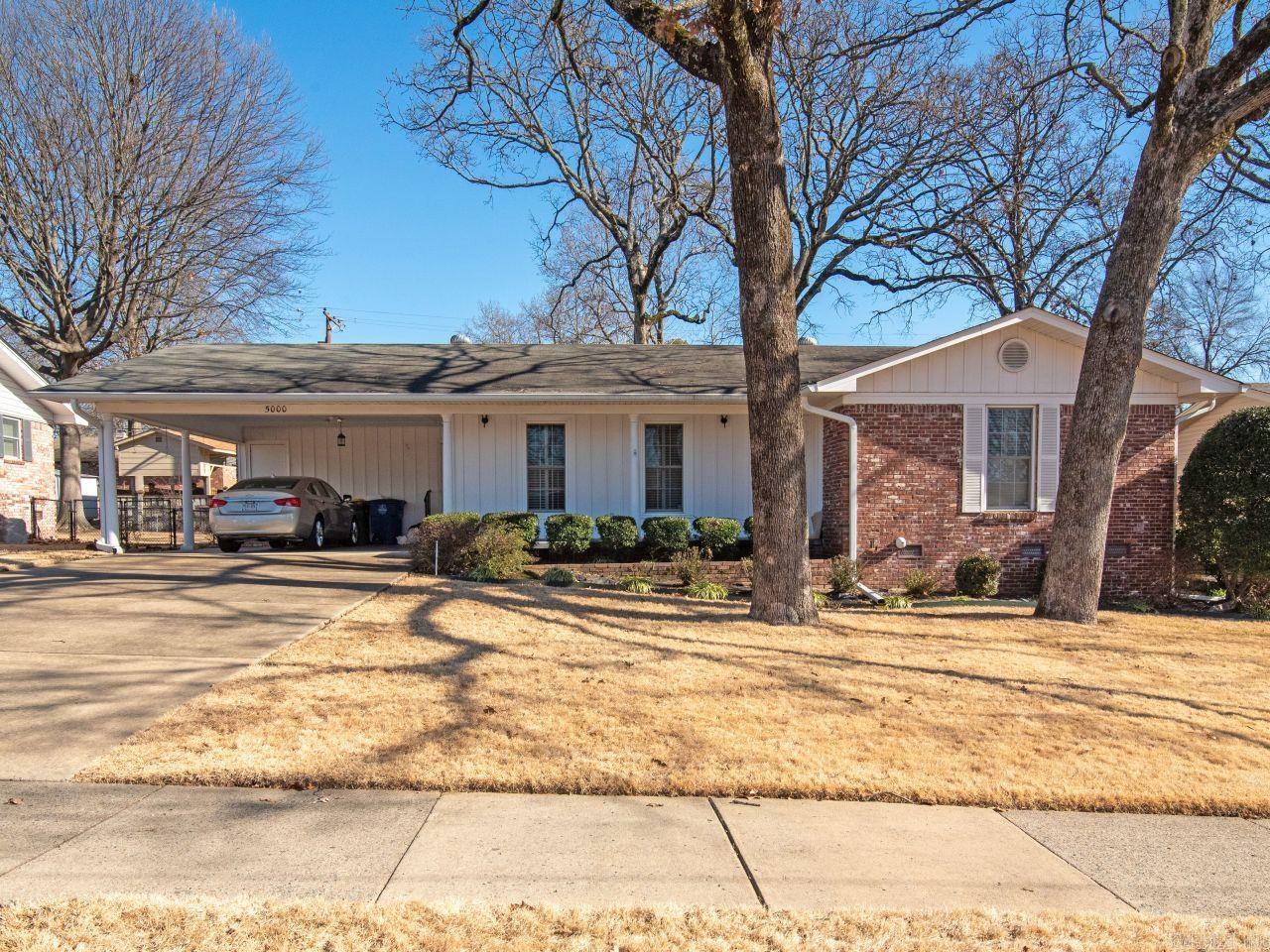 Wow! "Meticulously maintained with updates" may best describe this one owner home.  Beautiful site finished hardwood floors, crown molding, neutral paint colors, kitchen updates include soft-close cabinet doors with pull out shelving, pantry, tile backsplash, under cabinet lighting, tile flooring. This move in ready home includes 2-3 living areas or separate dinning room, den/family room with fireplace, vintage tile bathroom has updated vanity while preserving coveted retro tile flooring and counter, tub with tile surround. Primary suite has walk-in shower, living room with plantation shutters. Large laundry room with sink,  A two car carport, storage rooms, sprinkler system, beautiful landscaping and grass compliment the traditional architectural styling of this one level home. Enjoy the large deck in the shady back yard.  Estate ownership so no seller's disclosures. A pleasure to show.   Agents see agent remarks.