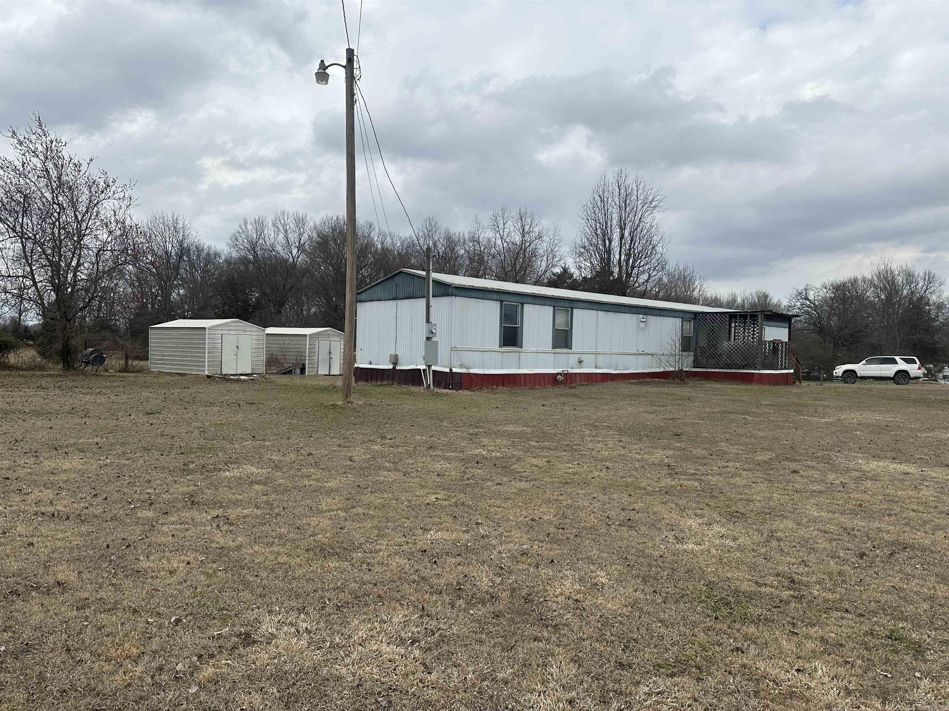 4 acres in Pottsville school district with a 3 bedroom, 2 bath mobile home. Most of the acreage has wire fencing and is ready for your horse or a a few cows. Schedule your showing today.