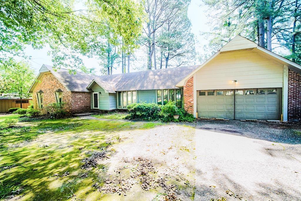 Fantastic Foxwood location with golf course views! This spacious 4-bedroom, 2.5-bath home backs directly to Southern Oaks Golf Course and offers a versatile floor plan with plenty of room to spread out. Inside, you'll find a formal living room, formal dining room, and a comfortable family room featuring a wood-burning fireplace. The kitchen opens to the family room and includes a breakfast bar, making it ideal for everyday living and entertaining. The primary suite offers double sinks, a walk-in shower, two closets, and private access to the expansive two-level deck overlooking the golf course. Generous secondary bedrooms, mature shade trees, and established landscaping further enhance the property's appeal. Though some repairs are needed, this home presents with solid bones, a desirable location, and scenic golf course views.