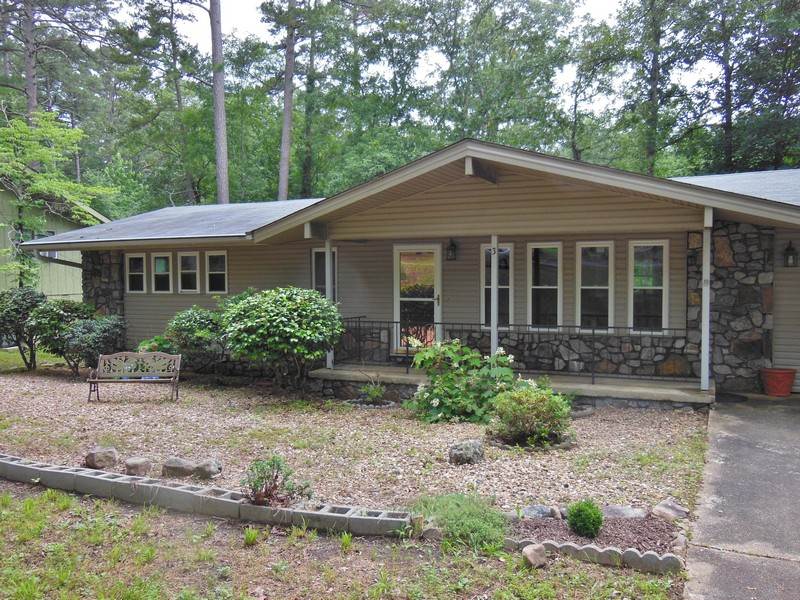 Meticulous and Well Maintained Home is conveniently located near walking trails, lake, golf course, restaurant and shopping areas.  Tastefully updated with wood floor, new windows, light fixtures, vanity fixtures, bathroom, heat & air (1yr), kitchen and newer appliances.  Delightful sun room with access door to a lovely sun deck.  Fenced in backyard with planters and raised bed gardens.  Come check this place out in person. Refrigerator negotiable. Agents see remarks.