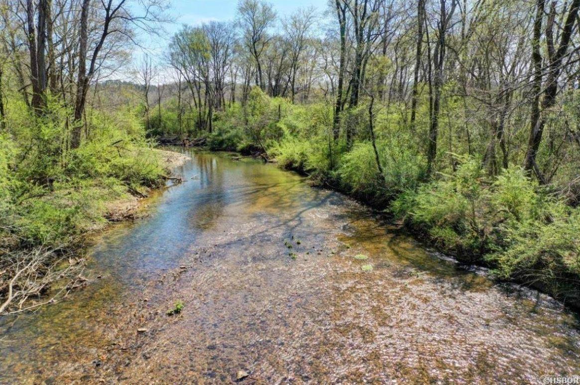 Prime 22-Acre Property with Highway & Saline River Frontage! Unlock the potential of this exceptional 22 acres of beautiful, level land! Located just 0.5 miles from the new bypass roundabout, this property boasts 200 feet of highway frontage and approximately 400 feet of Saline River frontage perfect for both residential and commercial opportunities!  Key Features: 22 Acres of prime real estate 200 ft of direct highway access for high visibility Approx. 400 ft of peaceful riverfront along the Saline River Spacious 40x50 shop building complete with an office and bathroom Beautiful, level terrain ideal for building, farming, or development Convenient location near major roads and shopping This property is a rare find, perfectly situated for both business and leisure. Whether you're looking to build your dream home, invest in a commercial venture, or simply enjoy the serene beauty of riverfront living, this land has it all! Don’t miss out on this unique opportunity!