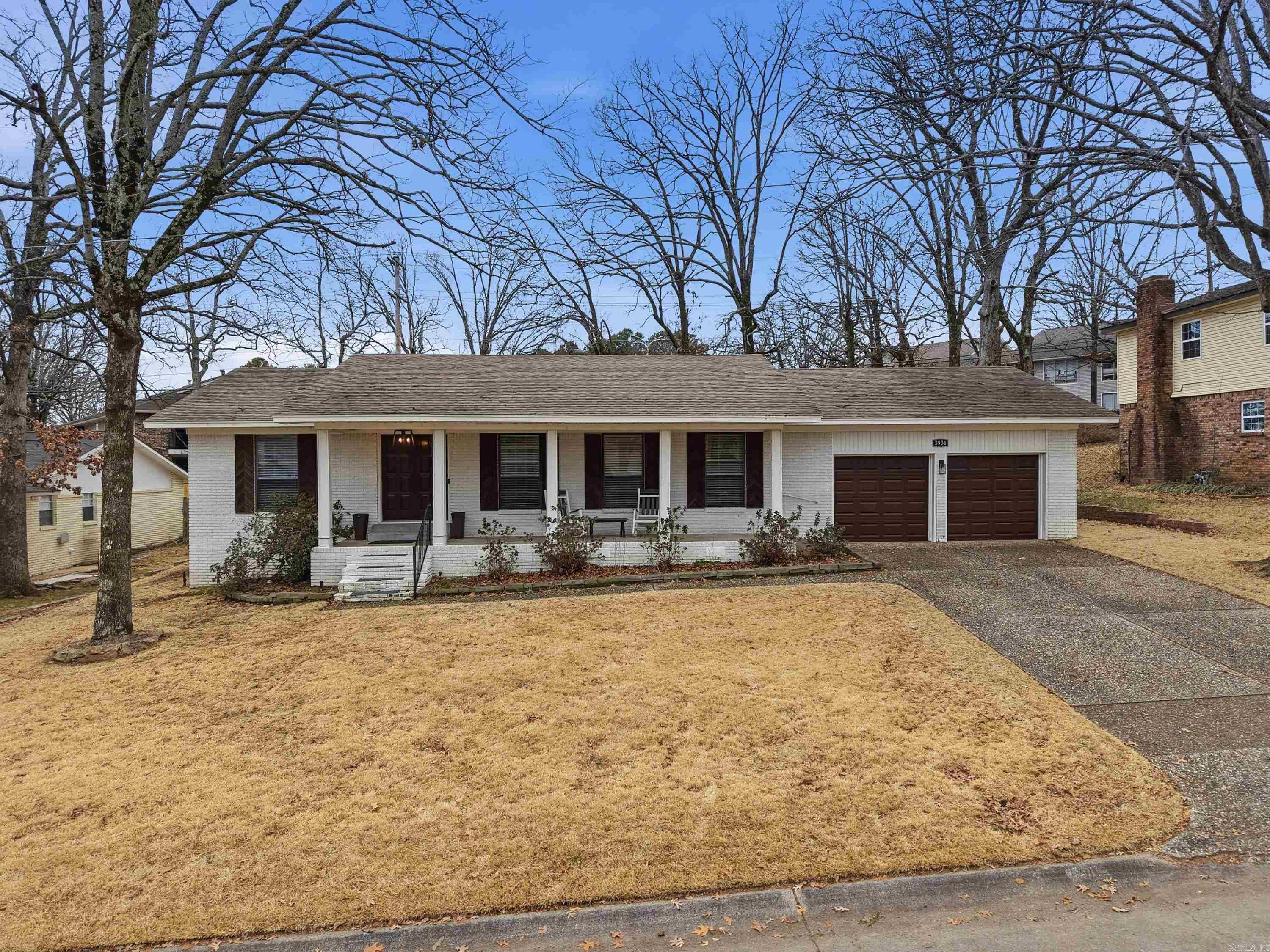 Come see this Lakewood gem that truly has it all! This well-maintained, one-level home welcomes you with a large covered front porch that opens into a spacious, open-concept living area. The living room features a wood-burning fireplace and flows seamlessly into the dining area and kitchen, perfect for everyday living and entertaining.The kitchen conveniently overlooks both the dining and living areas and features beautiful quartz countertops, a breakfast bar, and abundant storage. Just off the dining area, the study offers flexible space for a home office, library, or play area. All three bedrooms are generously sized with large closets. Step outside to a large patio overlooking the fully fenced, flat backyard. HVAC (2022) and tankless hot water heater (2024).