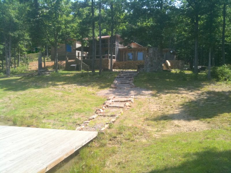 This unique cabin in the woods is located near both the National Forest and a State Park.  Only minutes from the 'Castle in the Clouds', Queen Wilhelmina State Park, there are hardly words to describe the workmanship and detail in this two story cabin. 1500 sq. feet on the bottom floor and 528 on the top, with a  view of your your own pond and the mountains beyond. If you seek privacy and peace in your own front yard, this is it! $ 129,900.00.