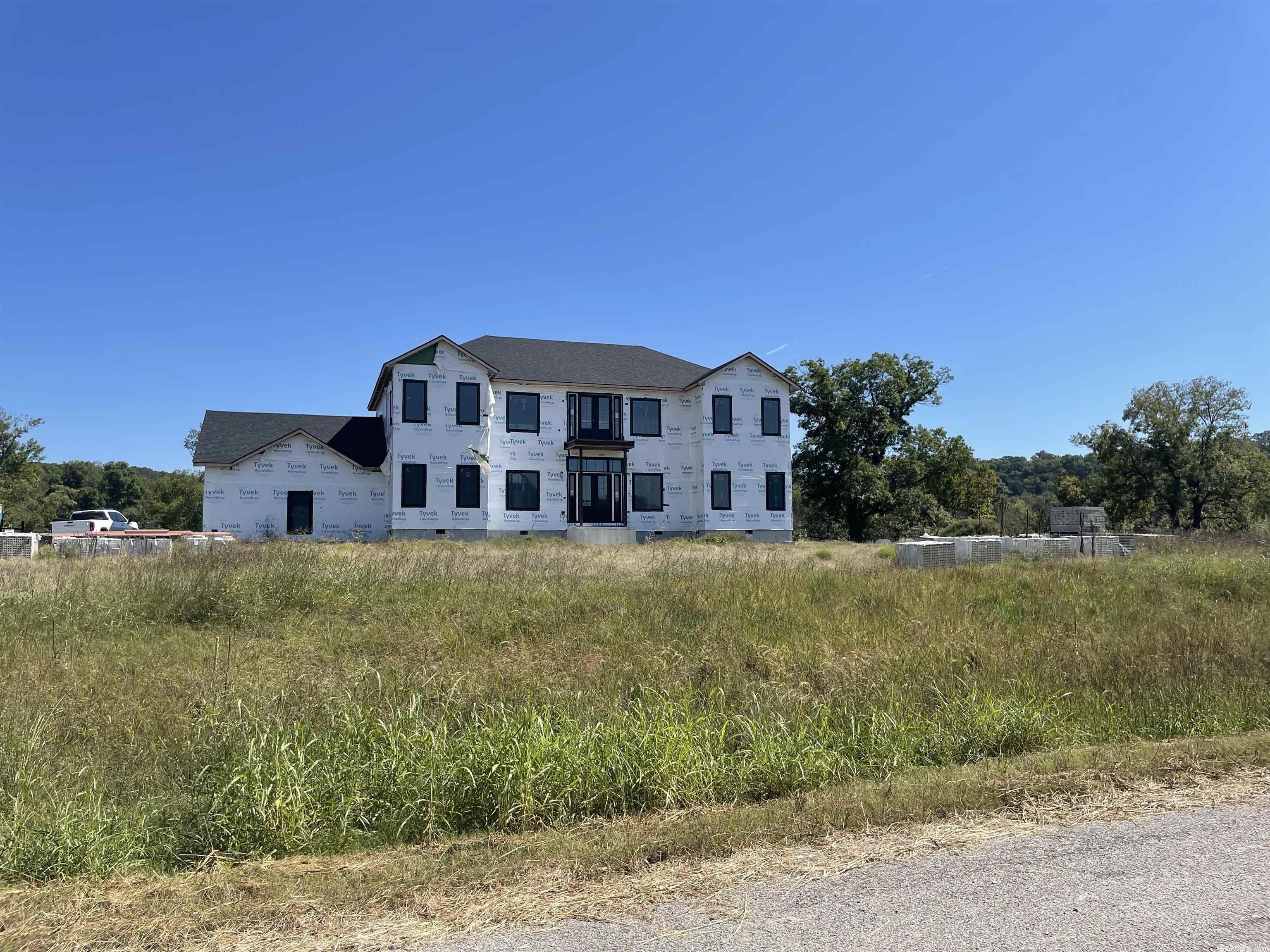 Beautiful location on the White River near Flippin. 4 bedrooms, 3.5 baths and ready for finishing touches on two lots (1.8 acres m/l). This  5000 square foot home offers  direct access to the White River. Located near Bull Shoals lake, recreational opportunities abound nearby. Home is unfinished. Materials on-site convey, inventory available on request.