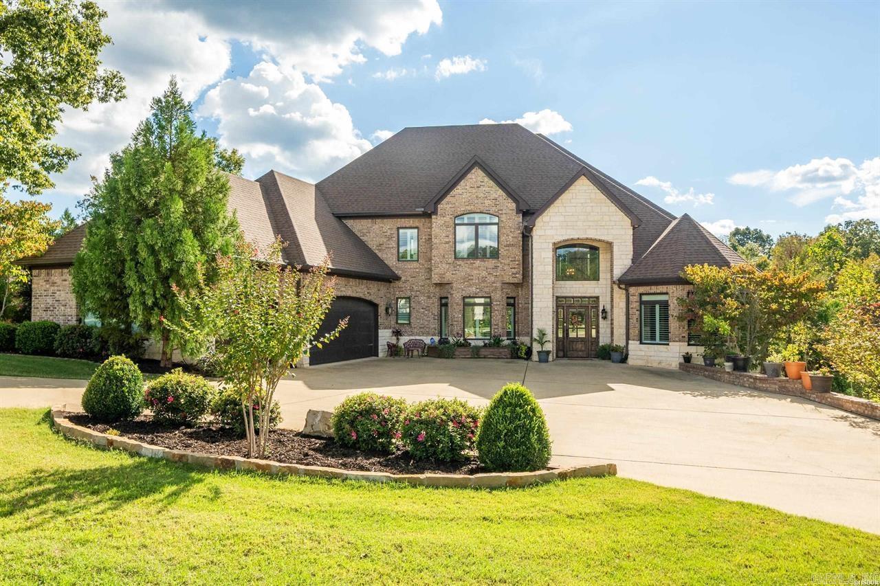 Experience luxury at its finest in this magnificent three-story home nestled within the gated community of Red Oak Ridge. Settled above the peaceful waters of Red Oak Lake, this elegant 6-bedroom, 8-bath estate spans more than 8,000 square feet of custom-designed living space.   A dramatic foyer with towering ceilings welcomes you inside, opening into an expansive living area perfectly designed for both relaxed hosting and entertaining. At the center of the home, the chef’s kitchen offers premium stainless-steel appliances, custom cabinetry, a spacious island, and a generous walk-in pantry—making it ideal for everything from gourmet cooking to casual family meals.   The adjoining dining area features a cozy fireplace and large picture windows that frame stunning views of the lake. Each bedroom serves as a private haven, complete with its own en-suite bath, walk-in closet, and custom finishes. The primary suite is a retreat with a spa-inspired bathroom. Across all three levels, discover multiple living areas, a private office, and a variety of decks and patios that overlook the lake and beautifully manicured grounds.