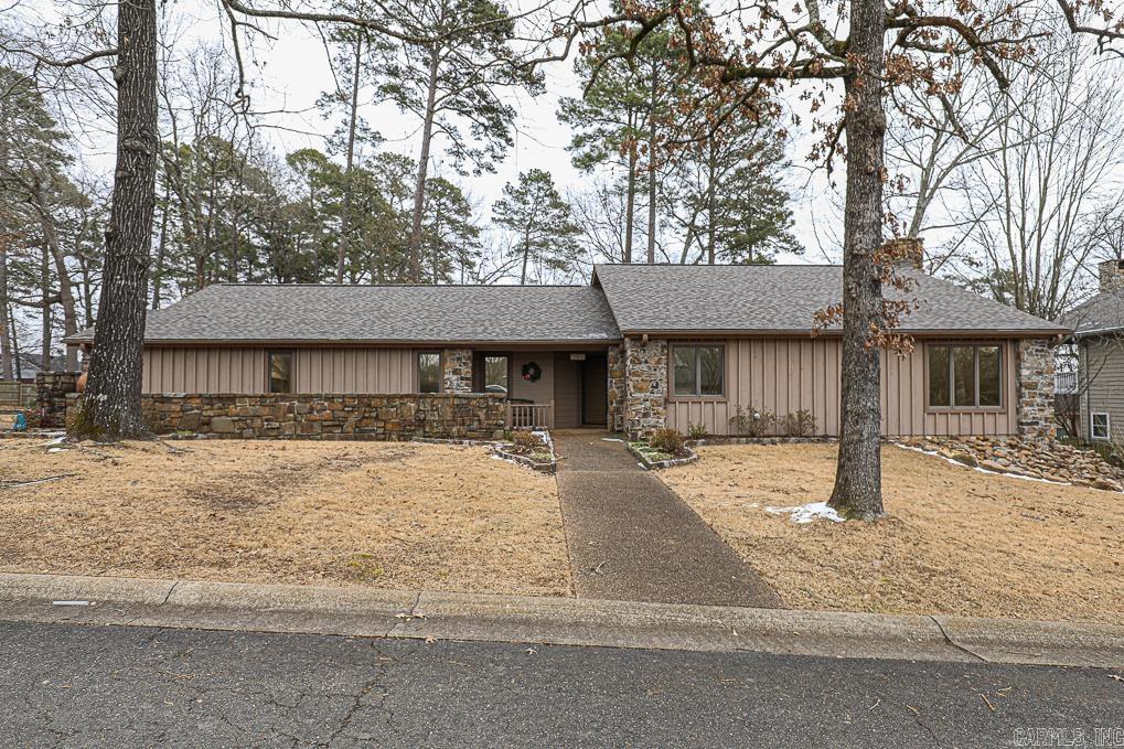 RARE FIND IN THIS WELL ACQUAINTED NEIGHBORHOOD ON CATALPA CIRCLE. VERY WELL KEPT HOME WITH A NEW ROOF, NEW GUTTERS,A NEW SLAB TO PARK ANOTHER CAR, A NEW COVERED PATIO OUT BACK AS WELL AS A SIDEWALK. A NEW TILE BACK SPLASH IN KITCHEN AND THE INSIDE OF THE HOME WAS COMPLETELY PAINTED LAST YEAR. THIS WONDERFUL HOUSE ALSO COMES WITH A WHOLE HOME GENERATOR AND PROPANE TANK THAT CONVEYS TO THE NEW OWNER. THE SUN ROOM FULL OF WINDOWS COMPLETES EVERYTHING THAT YOU ARE GOING TO LOVE ABOUT THIS HOUSE AND THAT YOU ALSO HAS A VIEW OF LAKE HAMILTON FROM YOUR FRONT YARD. ONE OTHER THING IS THE CIRCLE IS VERY GOOD FOR TAKING WALKS IN THE PARK LIKE SETTING.