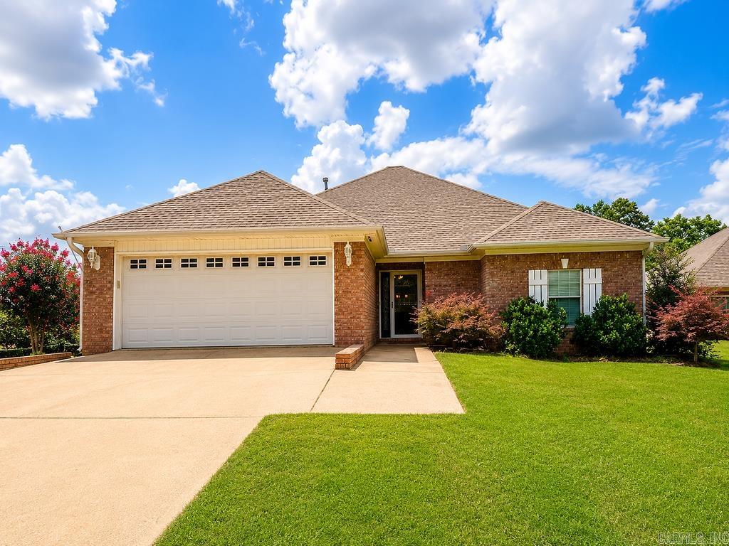 Check out this well maintained home on a large corner lot within minutes of the LRAFB and easy access to the freeway. Split bedroom floorplan with large primary bathroom to include marble shower and vanity top which is plumbed for double vanities. Hardwood flooring in living area, hallway and primary bedroom. Gas log fireplace with faux rock exterior. Outside you will find a 14 x 14 workshop/storage building (with electric and window unit), covered back patio approximately 18x45, and a privacy fenced yard. Roof 2018. Water heater 2021. Garage springs 2022. Playhouse in backyard conveys. AGENTS please see remarks.