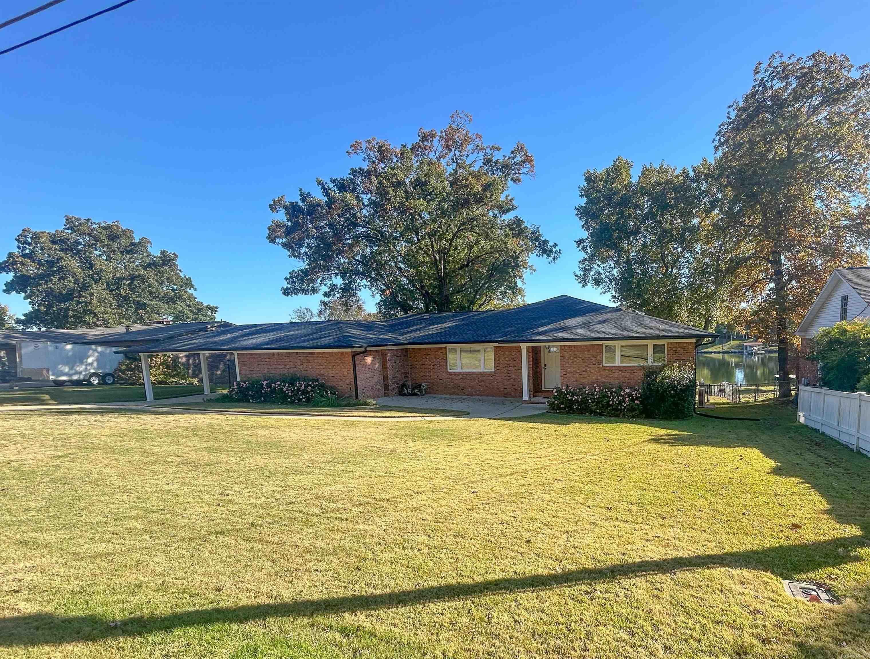 Beautiful brick home on Lake Hamilton featuring stunning views, a fantastic location, and stylish modern updates. Enjoy lakefront living with your own private boat dock—perfect for relaxing or entertaining by the water.