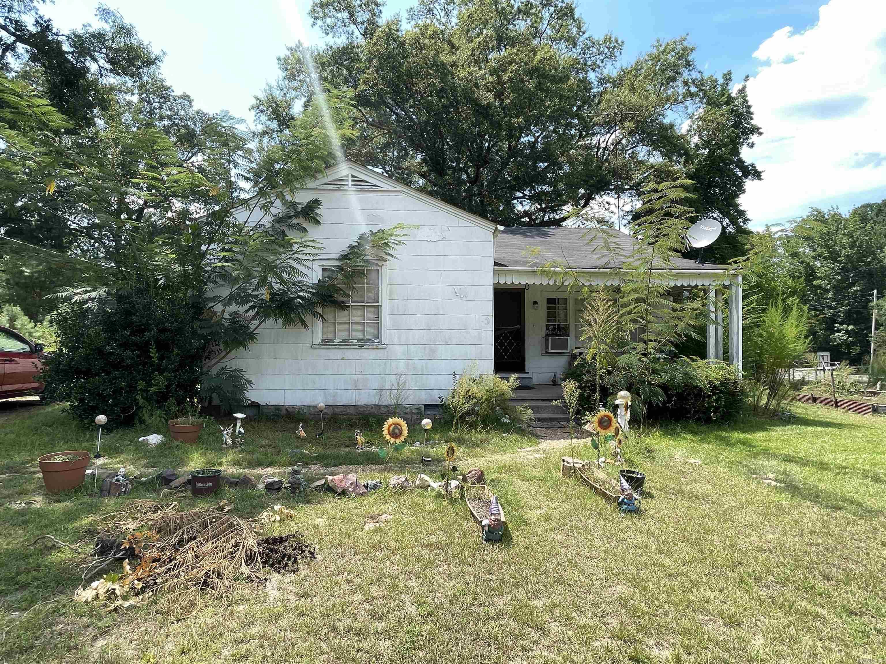 Opportunity awaits with this diamond in the rough! Situated on over 2 acres of land, this property offers the perfect canvas for your vision. Whether you're an investor, builder, or homeowner looking to create your next retreat, the possibilities are endless.  The home needs work but offers solid bones and a layout full of potential. With plenty of space to expand, garden, or even add outbuildings, you'll love the freedom and privacy this large lot provides.  Get a head start with new gas stove and stainless steel fridge!  Located in a peaceful setting yet conveniently close to town, this is your chance to turn a fixer-upper into something truly special. Bring your tools and imagination—this one won't last