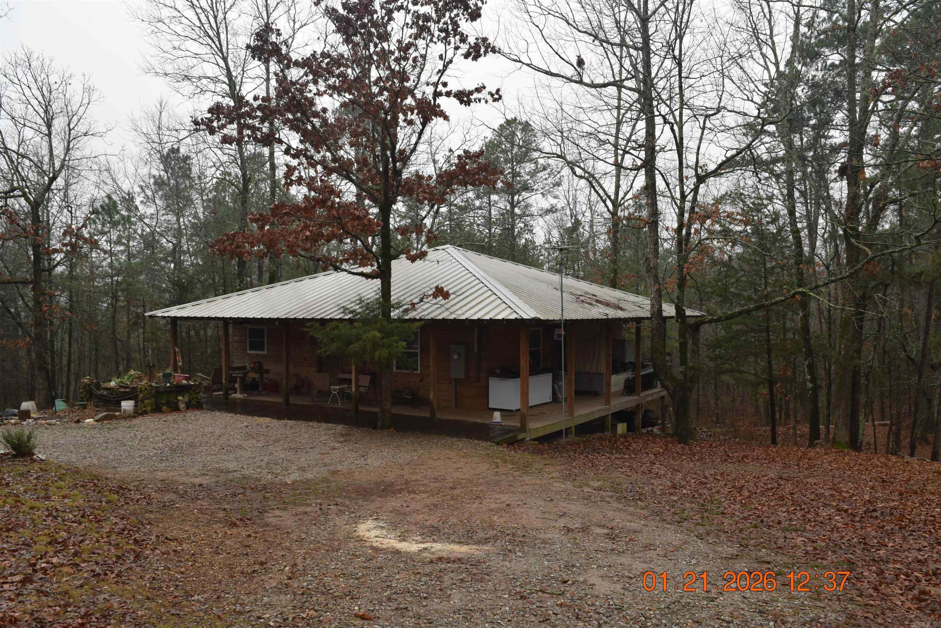 2-bedroom, 2-bath home situated on approximately 4 +/- acres, with final acreage to be determined by survey. The property also includes an unfinished tiny home, offering additional space and potential for future use.  Multiple purchase options are available. Buyers may purchase this home with approximately 4 +/- acres, purchase the adjoining approximately 4 +/- acres that include a second 2-bedroom, 2-bath home, or purchase the entire parcel. For information regarding the purchase of the entire parcel, see MLS #26003211  The current tax amount is based on a larger parcel that includes multiple properties. Taxes are expected to be adjusted following the survey and division of the property. Acreage amounts are approximate and subject to survey