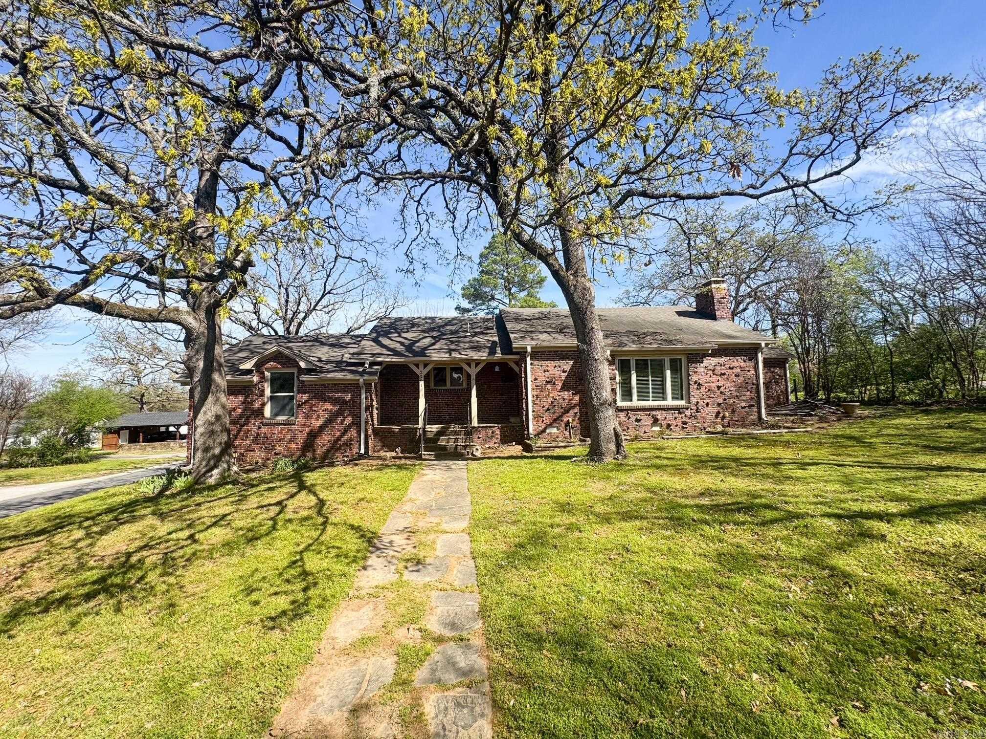 Charming 2 bed, 2 bath brick home situated on a spacious corner lot! Features include a fenced backyard, covered carport, and a one car garage. With plenty of potential, this property is ready for you to make it your own!