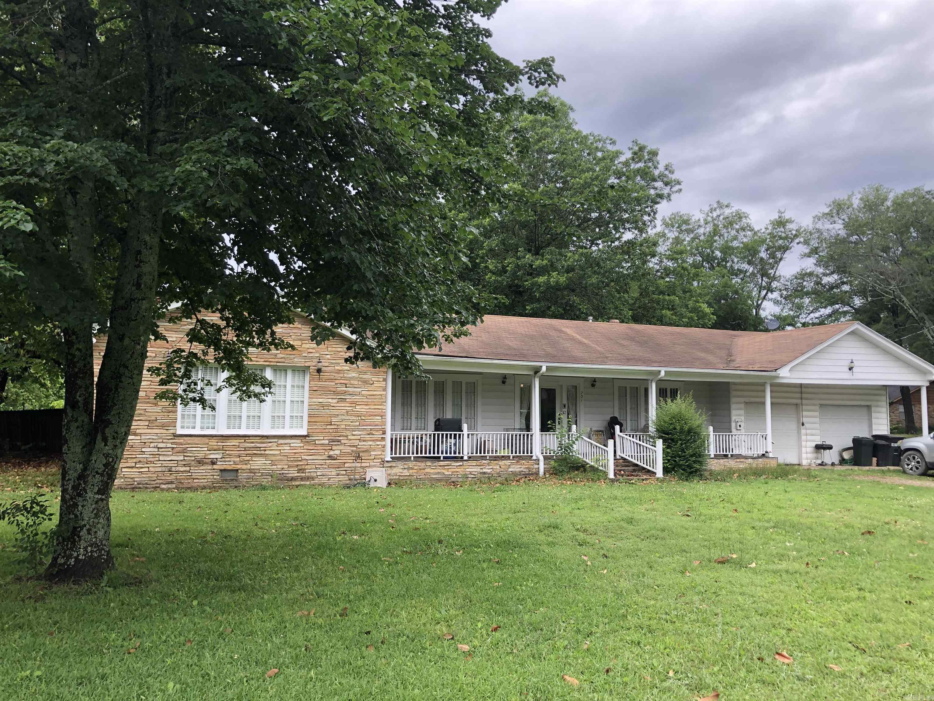 Don't miss this amazing opportunity! This home has 3 bedrooms, 3 full bathrooms,  more than 2,400 square feet, and sits on over an acre! Plus a built-in insulated shop with central HVAC so you can be comfortable year-round while working on your projects. Also has a 12 x 20 storage shed. Gas log fire place and double water heaters. This house was built on a historic home site, and reportedly includes some of the original materials from that home. Even has mature pecan trees! An exceptional value, come check it out for yourself!