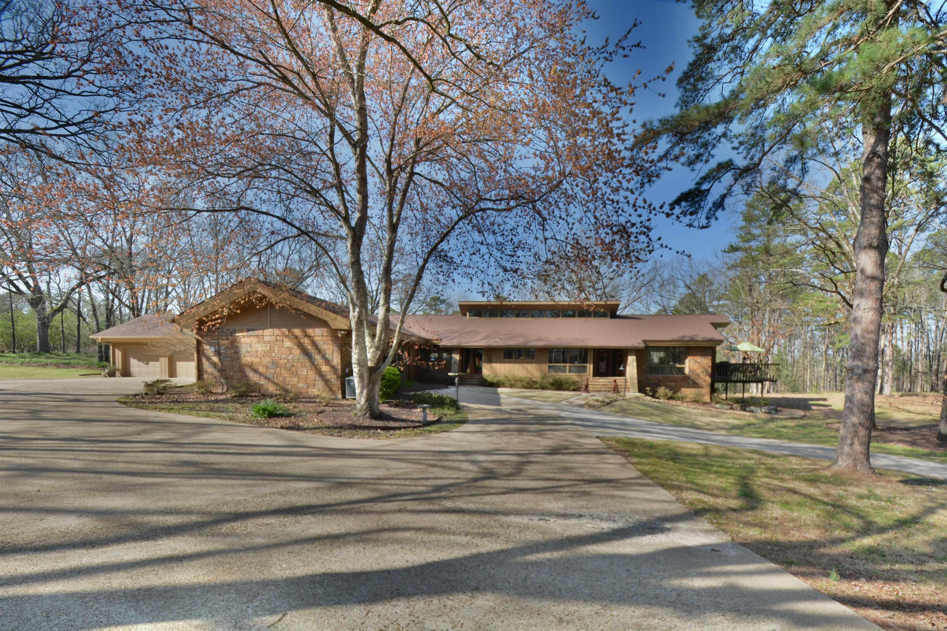 This stunning, custom-built one-level home is an absolute must-see. Two minutes from the prestigious Lakeside Schools, it boasts 4916 sq ft (including the pool house) and sits on 3.4 beautiful park-like acres.Nestled in a small neighborhood that provides privacy but convenience for shopping, this home offers four bedrooms, including two primary suites with adjoining private baths.  Adjacent to the primary bedrooms, you’ll find an exceptional closet system, a walk-in closet, and a laundry room. At the other end of the home are two bedrooms, each with an ensuite bath. The house has two rock fireplaces, vaulted ceilings, hardwood, flagstone, and tile flooring, and a gourmet kitchen with stainless steel appliances and granite countertops. Pella windows and doors open to a large deck for entertaining and wildlife viewing. There are two large flex rooms, an oversized 3-cargarage, and extra parking pads. An enclosed breezeway with a storage area off the garage leads to a dog run for your pet.  An 18 x 36 in-ground pool is the property's centerpiece for hosting poolside gatherings or basking in the sun. This oasis is perfect for relaxation and rejuvenation, with a pool house --->