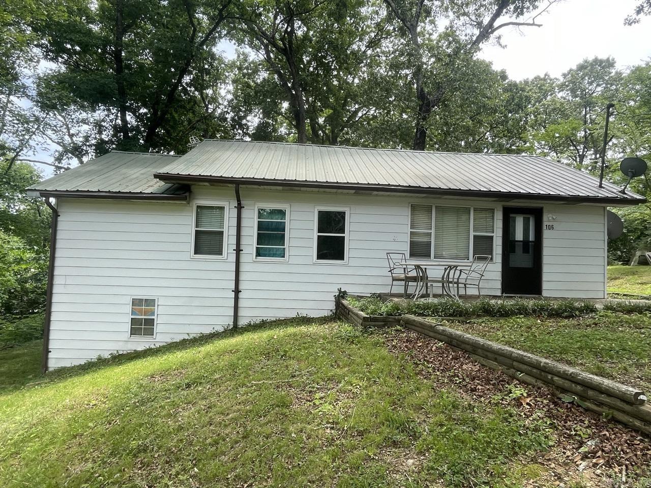 Opportunities like this do not come around often in Hot Springs! Situated on a rare and desirable 3.07-acre lot, this property offers the perfect blend of space, privacy, and incredible development potential. Whether you are looking for a unique primary residence, a short-term rental investment, or a property with room to expand and build, this acreage is a blank canvas.  The home features a spacious 4-bedroom, 1.5-bathroom layout, offering character and solid bones ready for your personal touches or modern updates. Step outside to find the ultimate workspace or storage solution: a massive 30' x 56' detached shop equipped to handle everything from heavy equipment and boat storage to the ultimate hobbyist’s workshop.  Located just minutes from the lakes, historic downtown, and local attractions. Land is a finite resource in Hot Springs—don't miss your chance to own a piece of it with room to grow! Schedule your showing today. Agents see remarks.