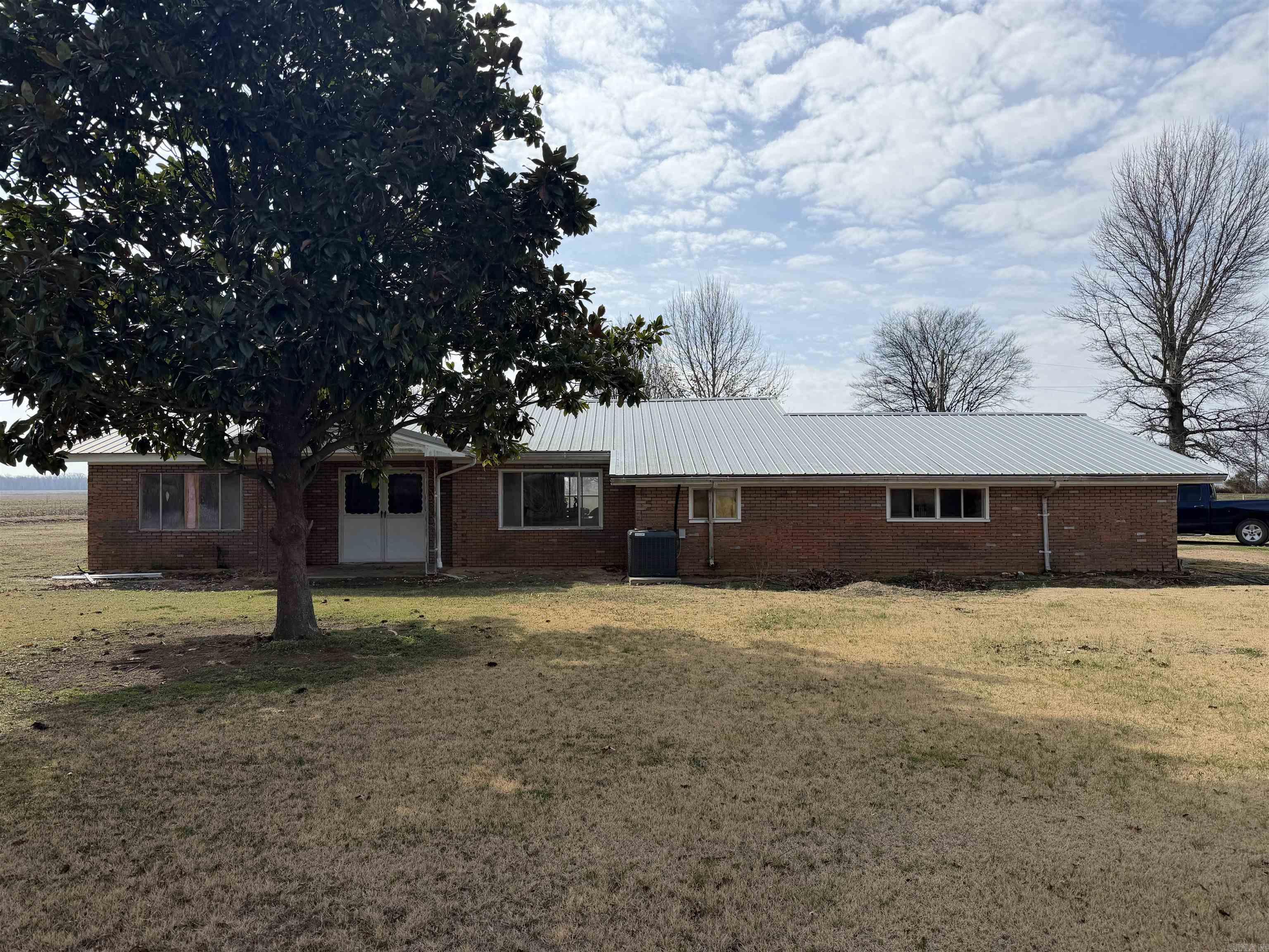 Welcome to peaceful country-style living! This 3-bedroom, 2-bath home at 620 Dock Street Nimmons, Arkansas sits on a spacious 3.57-acre lot and offers 1,803 square feet of comfortable living space on a quiet dead-end road, providing privacy and a relaxing setting. Inside, you’ll find a large family room perfect for gatherings, entertaining, or cozy nights at home. The home has seen several important updates including a new roof, new HVAC system, and new windows, giving buyers peace of mind and improved energy efficiency. Step outside and enjoy the property’s standout features. A screened patio offers the perfect spot to relax while overlooking the beautiful acreage. The property also includes a stocked fishing pond, creating your own private retreat for fishing and outdoor enjoyment. A garage adds convenience and extra storage. With acreage, major updates, and a peaceful location just minutes from town, this property offers the perfect balance of comfort, space, and outdoor living. Don’t miss this rare opportunity to own a beautiful home with acreage in Clay County, Arkansas!