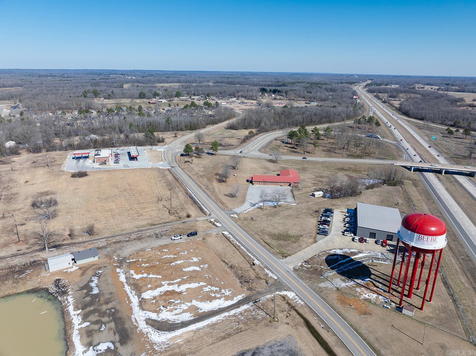 Great opportunity to grab a piece of land currently zoned C-2 that is close to Exit 29 on I-57 and close to even more growth in the future.  1.87 Acres with full visibility of I-57 and fronts Access Rd. A future city road will run down the right side of the property making this a corner lot.  That road will lead to the cities proposed sports complex that will be located behind this property. In the beginning this complex will  host 5 softball fields.  There is a new residential subdivision that has experienced rapid growth the past several years and is within a half mile.  The current city ball parks and city recreational/pool area are also less than a half mile away.  There is a 9 acre pond just to the rear of the property but there is currently NO access to the pond as it is NOT part of this property.  There are 2 small buildings that are in good condition on the property that will convey with the sale.  Call the listing agent today for more information.