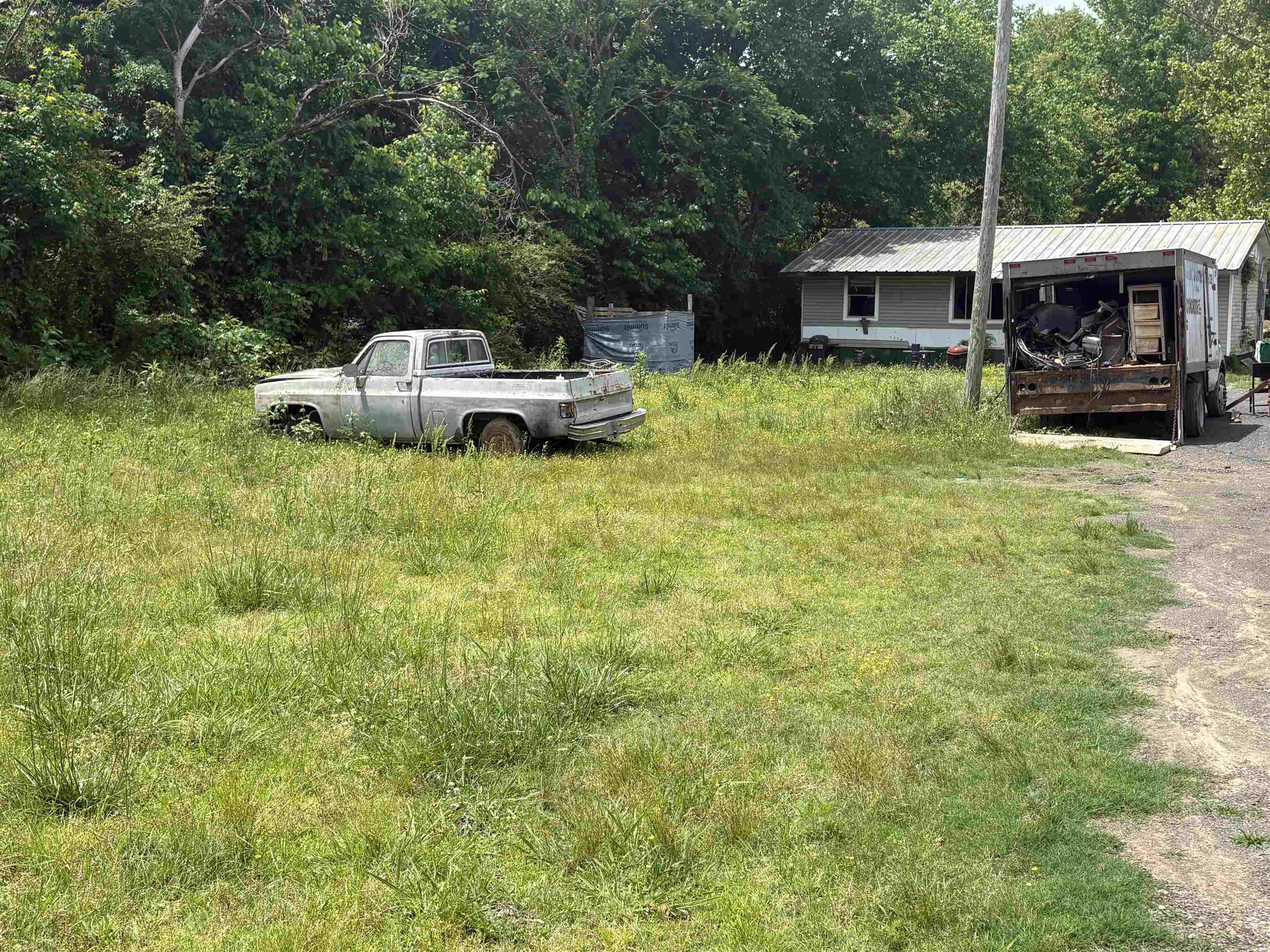 Great investment property with three homes and a large shop. Homes are livable, but are in need of repairs. With a little TLC, this diamond in the rough could be amazing. Property is being sold as-is. AGENTS PLEASE SEE REMARKS.