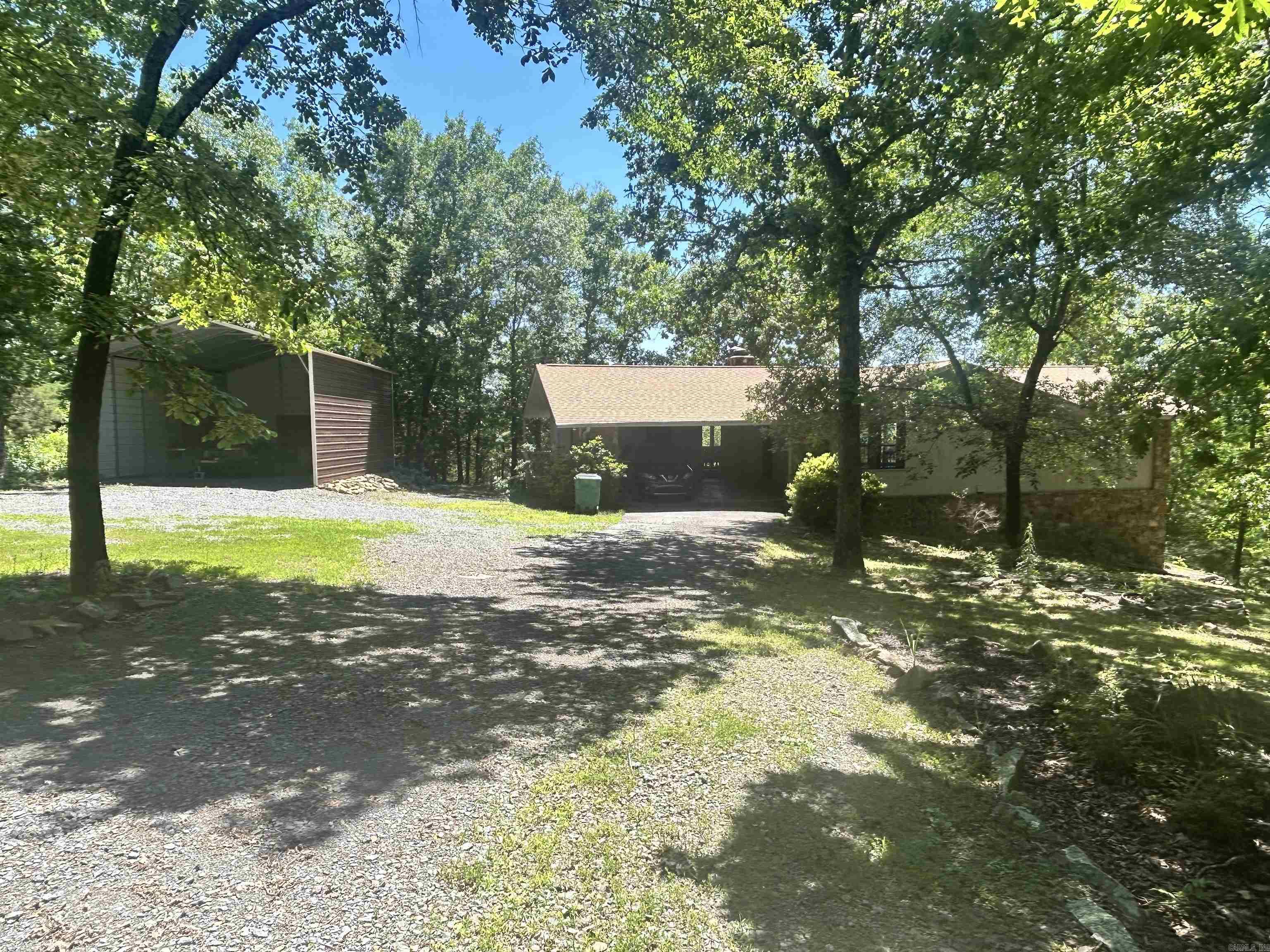 3 bd / 2 bath home. It has a circle drive with RV / boat parking and carport to keep them covered. Main level has open living-dining area with a wall of windows and glass doors to capture the view. Plenty of room for all the family, or perfect for just two with master bedroom on main living area. Walk out basement with fireplace and small kitchen area. Could be used as separate rental with it’s own entry. 1 acre lot, fenced back yard for pets or young ones. Relax on the deck with your morning coffee and look at Greers Ferry Lake along with expansive mountain views. You are minutes away from lake access for all your water activities. Come take a look you won't be disappointed.