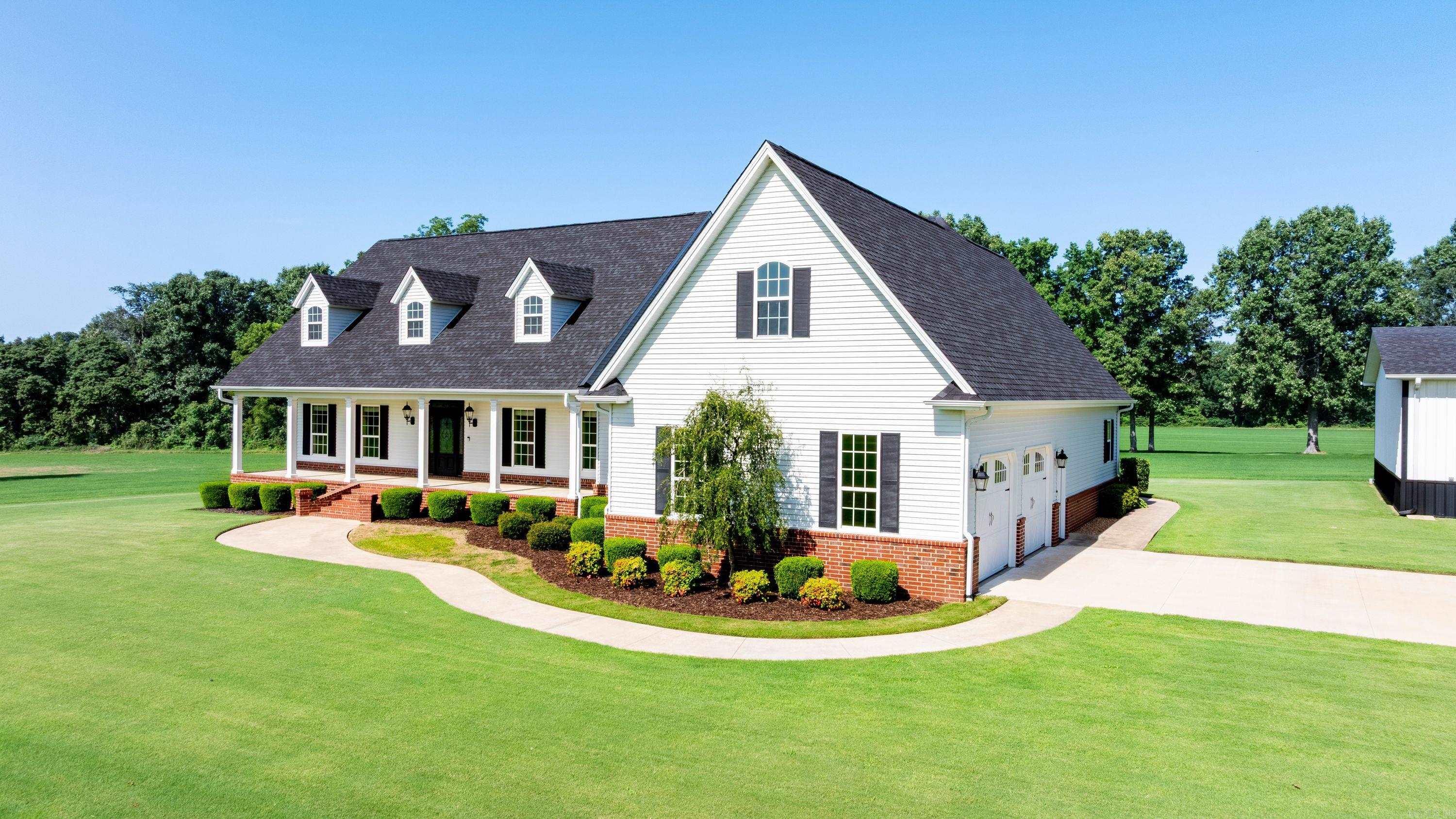 Magazine-Worthy Luxury Country Estate on 46 +/- Acres in Greene County! This one-owner custom home offers over 6,000 sq. ft. under roof (approx. 4,500 heated/cooled) and is surrounded by manicured Bermuda pastures, a pond, creek, mature trees, and breathtaking country views. A long paved drive welcomes you to this exceptional property featuring 4 bedrooms, 3.5 baths, an oversized garage with concrete safe room, and a thoughtfully designed floor plan. The chef's kitchen boasts Corian countertops, stainless built-in appliances, abundant cabinetry, a large island, and opens to the dining area and spacious living room. Enjoy a 444 +/- sq. ft. screened sun porch overlooking the pastures with access from both the kitchen and living room. The main-level primary suite features dual closets, a bonus room ideal for an office or nursery, and a luxurious bath. Upstairs offers a second living area, oversized bedroom, full bath, and storage—perfect for guests or recreation. Additional highlights include a functional mudroom with built-in shelving, a 1,600± sq. ft. shop, beautiful pond, creek bordering two sides, and income-producing Bermuda hay fields. See Additional Documents for more info!!