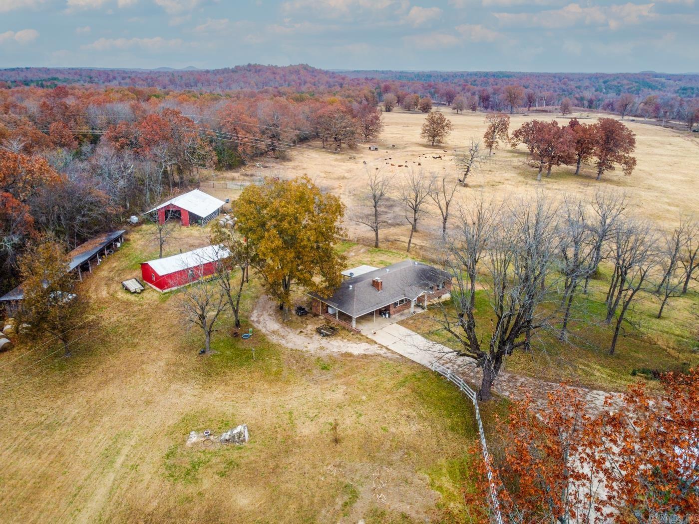 Welcome to Market this beautiful outdoor oasis 117 +/- Acre farm and home loaded with potential. Currently running over 30 head of cattle on the front portion it boasts acres and acres of picturesque scenery. This property features three ponds, Barren Fork creek running through the property, and an abundance of wildlife. This property has prime opportunity for hunters as if the 117 acres wasn’t enough, this land also butts up to corp land on the back of the property that leads to Lake Norfork. Situated just a few miles from the lake, this property could be ideal for someone who loves the enjoy lake activities. The upstairs of the home features two bedrooms and one bathroom. The basement is unfinished and ready for its next owner to customize and make it their own. The basement previously had two bedrooms and is setup to add another bathroom. The barns and outbuildings provide numerous storage for hay, utility vehicles, equipment and so many more possibilities! The front portion of the property features walnut and pecan trees. This property boasts ton of potential. Call today to take your private tour of this breathtaking property.
