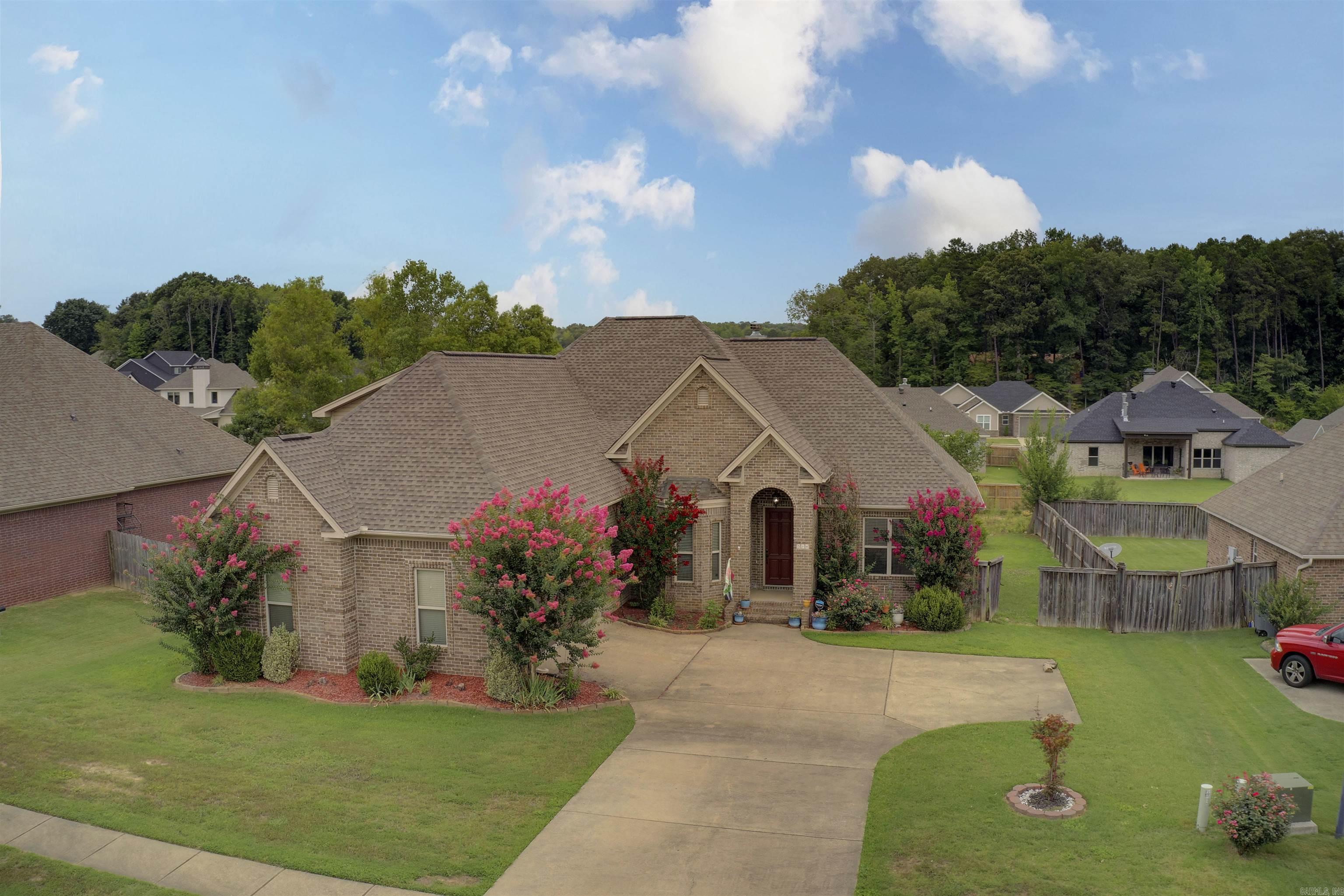 This home is move in ready! This home is located in a quiet neighborhood with gorgeous hardwood floors throughout the main areas of the home, a breakfast nook off the kitchen that includes beautiful stained cabinets, a dinning room, bonus room, 3 bedrooms and 2 bathrooms with a split floorpan. The backyard is large with a covered back porch, large concrete patio and the playhouse does convey with the property. Book your showings today and fall in love with this home!