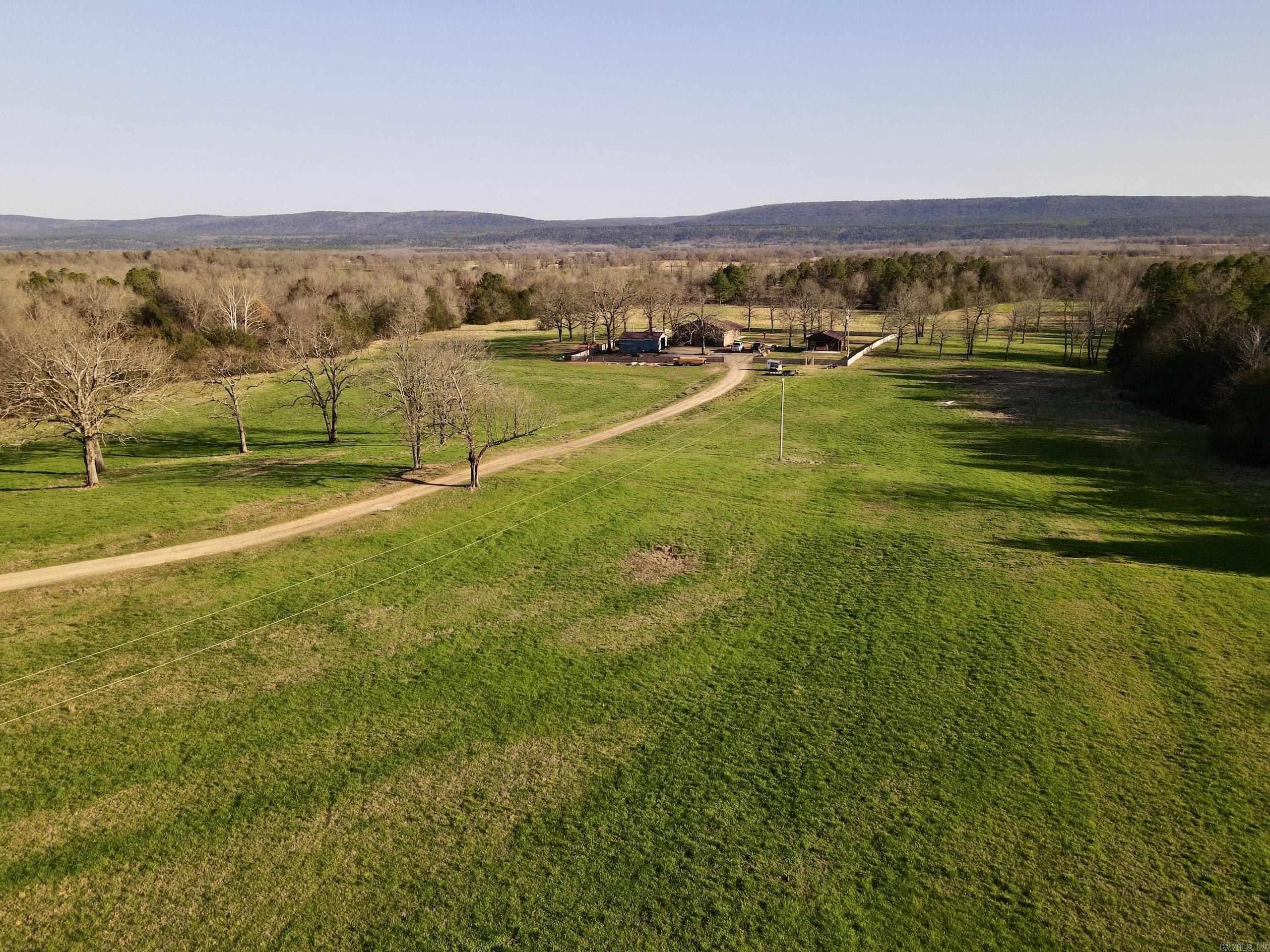 This is a rare opportunity to own an excellent farm that is completely high-fenced with an 8 ft. chain-linked fence. Two Mile Creek flows across the gently rolling terrain, which is a great mix of improved pasture and timber that attracts and holds wildlife and has consistently produced large deer. The neighboring property on the west and south borders are pine plantations and are excellent bedding areas for the deer and turkey that also use this farm. Minerals owned by the Seller convey.