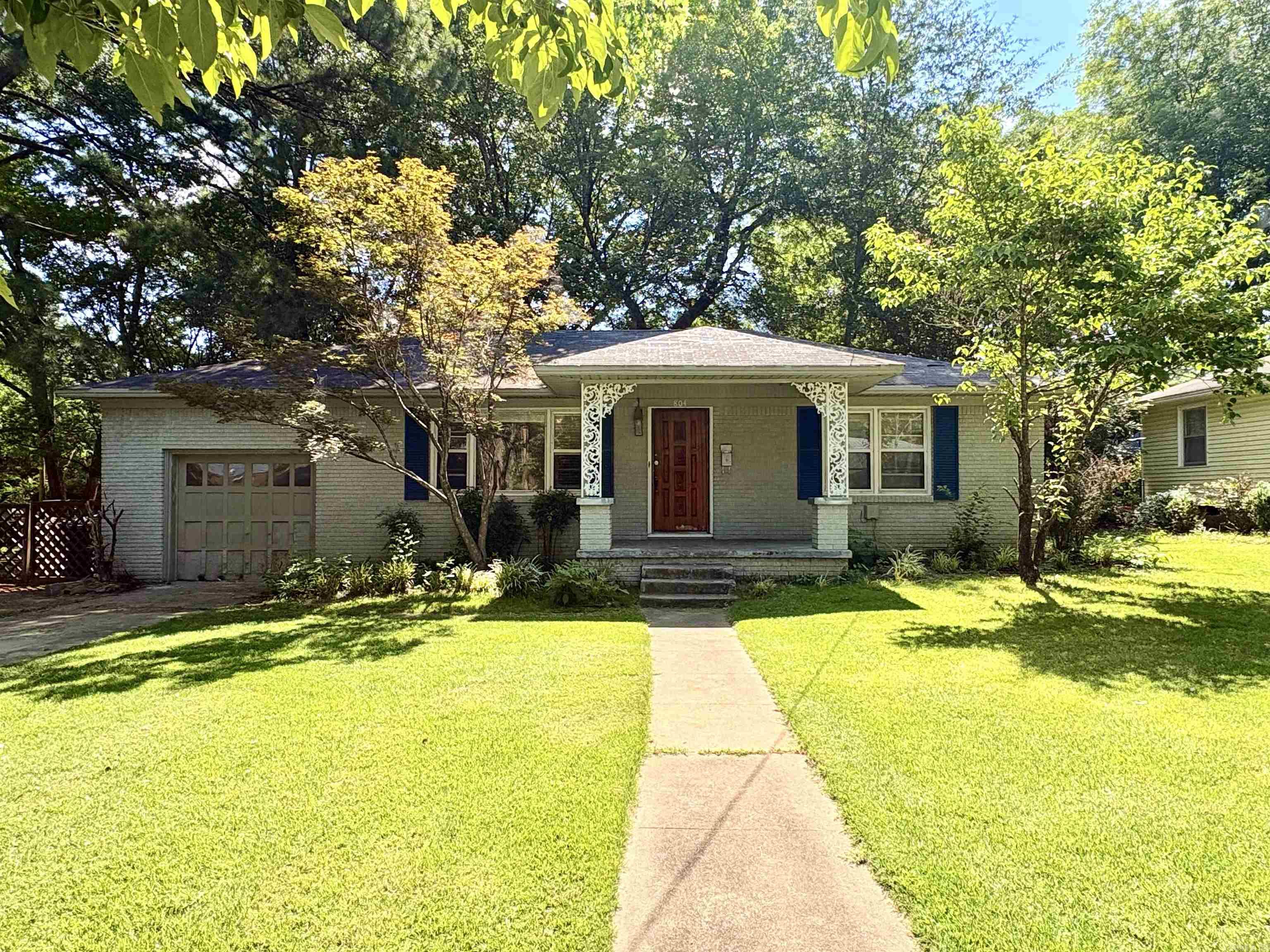 Charming Vintage Home — Hardwood Floors, Mature Trees, Great Location Beautifully sited vintage home in a desirable, tree-filled neighborhood offering timeless character and a peaceful feeling. The owner has cared for the property—original hardwood floors remain throughout and many systems are being refreshed. Interior and exterior painting are underway; the seller is also installing a new roof and repainting the garage door and other touchups. Conveniently located just a few blocks from Race St., close to Harding and downtown Searcy, the home blends classic details with practical updates. Don’t miss this lovingly maintained home with great curb appeal and neighborhood charm.