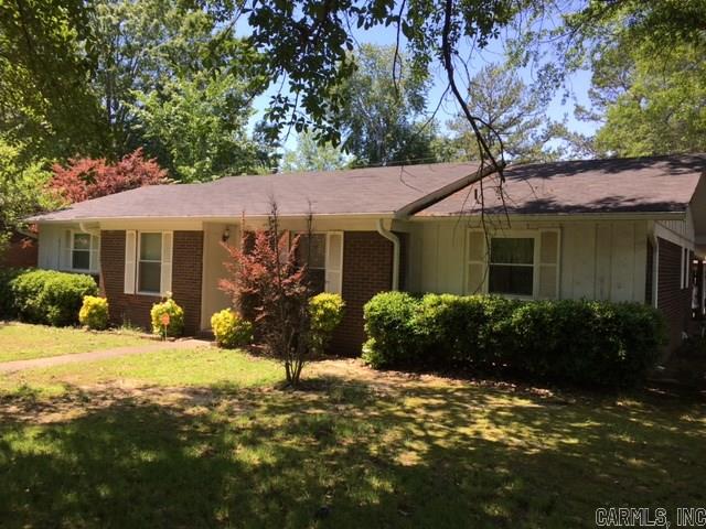 Cute corner lot home is established area. large fenced backyard,Large living area with fireplace,Laundry room, has a separate dining room. with a carport for two car.