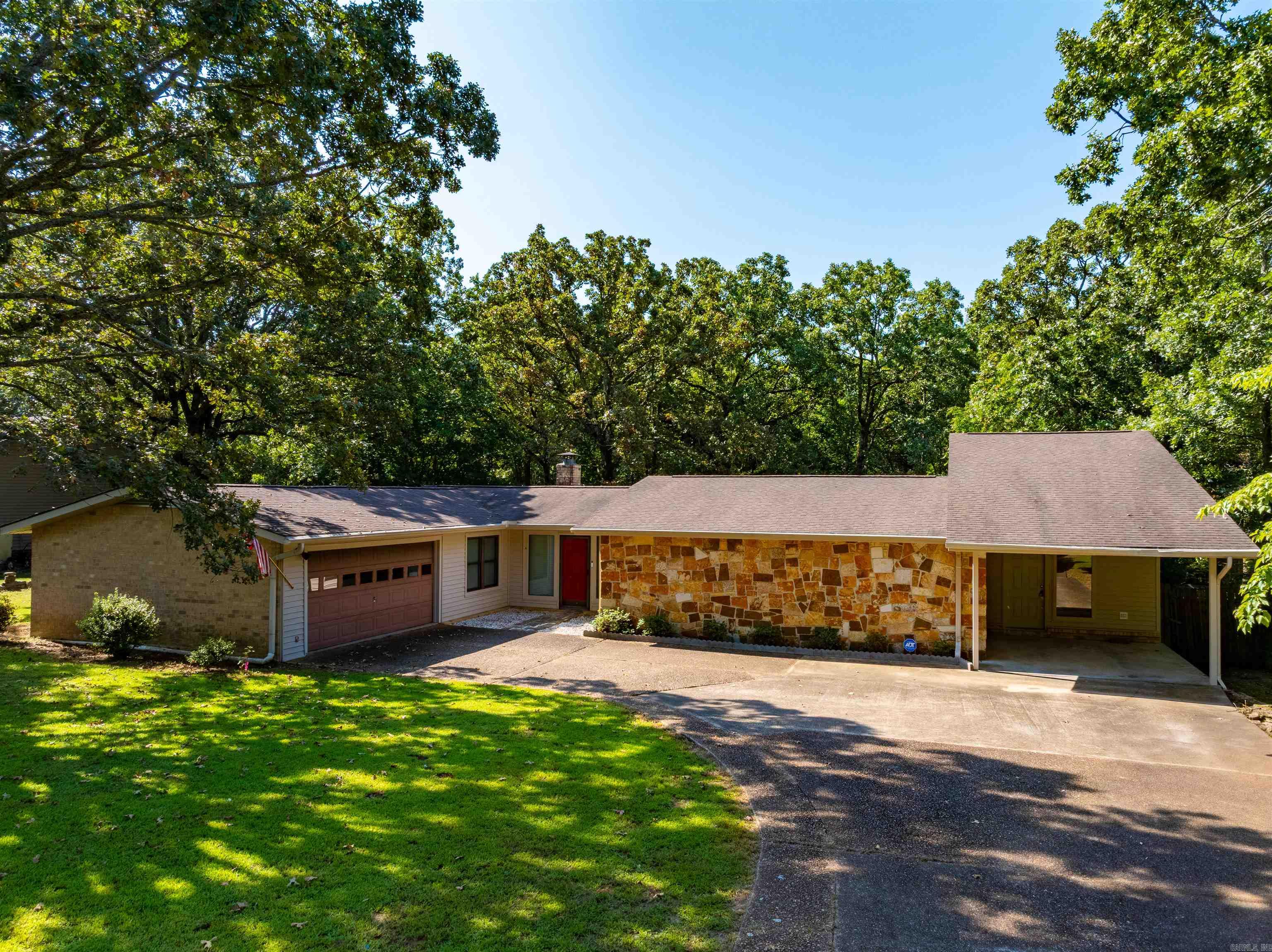 Welcome to 3360 Timberland Drive, a charming and spacious home just a short walk from Batesville Schools. With a perfect balance of comfort and practicality, this home offers everything you need for a relaxed, enjoyable lifestyle. Whether you’re hosting friends or just relaxing at home, the thoughtful design and spacious rooms create the ideal setting. From the moment you arrive, you’ll feel the welcoming vibe and see why this home is the perfect fit for your family.  The exterior of the home is designed for both practicality and enjoyment. A fenced-in backyard provides a safe and private space for children to play or for pets to roam freely. Step outside onto the large deck, perfect for hosting gatherings, enjoying a morning coffee, or relaxing with friends and family. Additional features such as a storage building, a carport, and an attached garage add convenience and flexibility, providing space for vehicles, hobbies, or extra storage. These extras make everyday living easier while offering opportunities for outdoor enjoyment and entertaining.  SUBJECT TO BANK APPROVAL