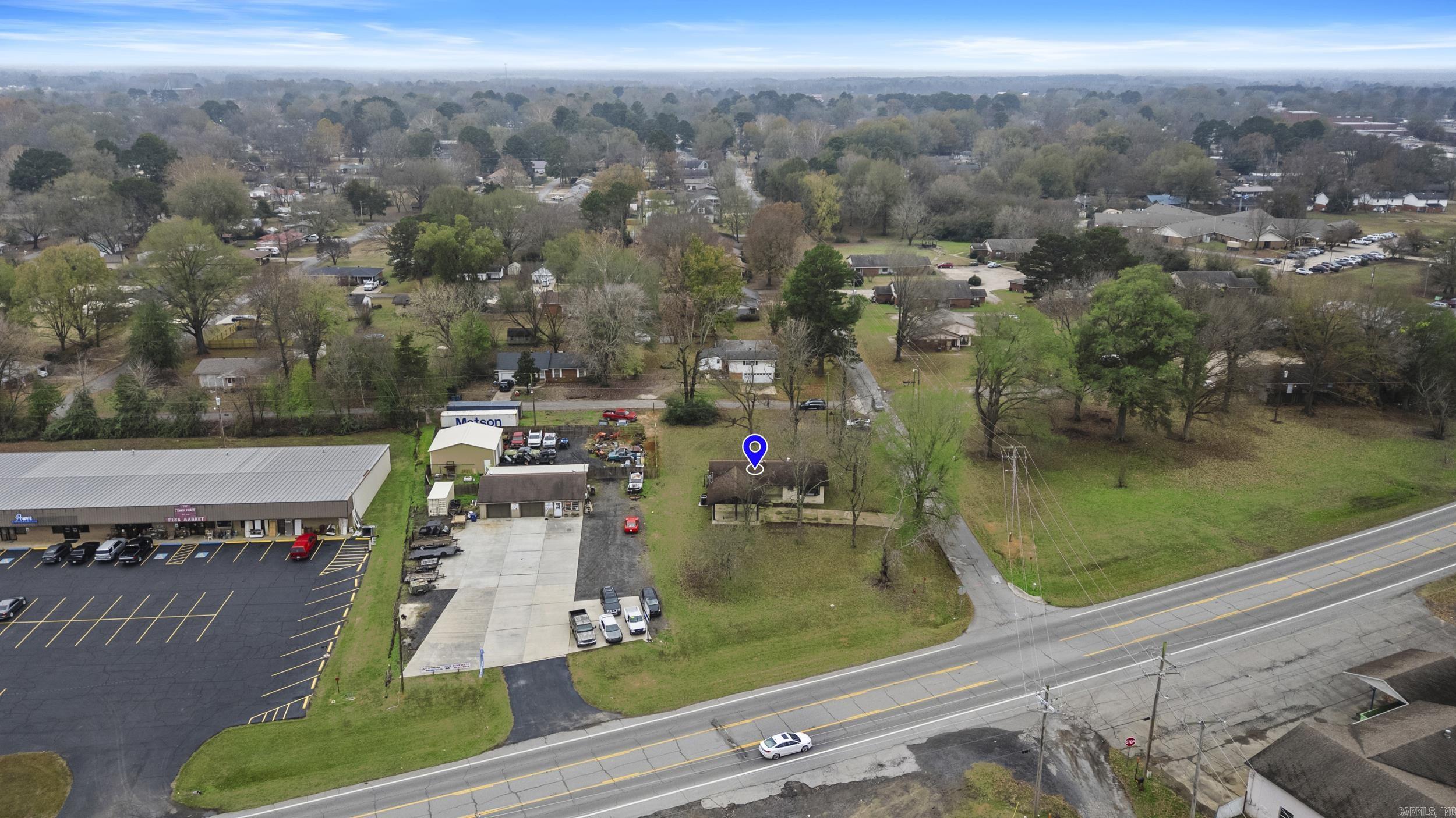 Property is on a generous corner lot in town with one side on Dewitt-Henry Drive, perfect for your C2 business! This home features a practical layout with large common areas, an open kitchen, and room to customize to your style of business. The oversized lot provides plenty of space for more parking with an additional driveway off Lemon. Beebe is growing and so are the clients in the area. Come be a part of the new wave.... Get your new business location today!