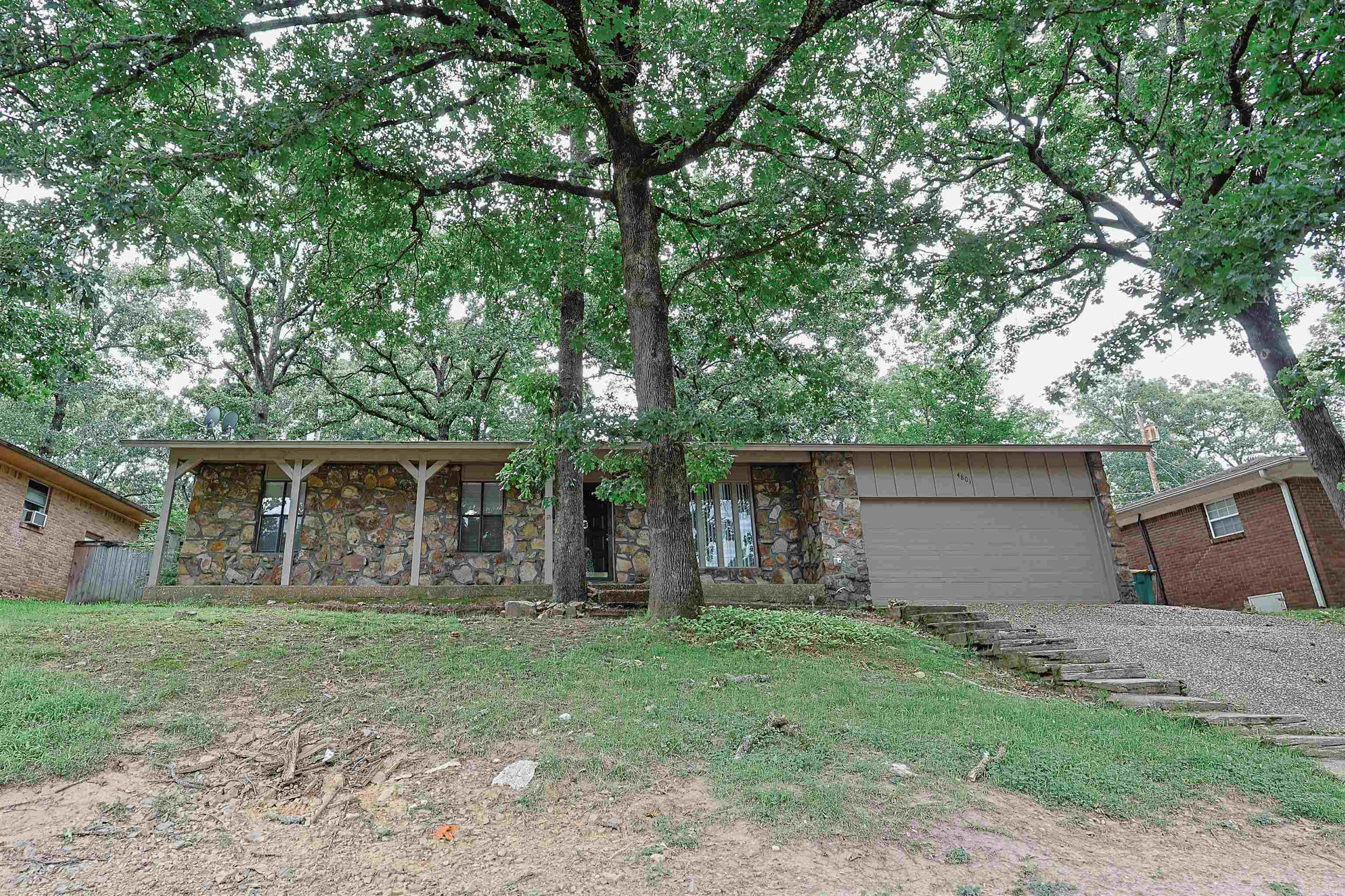 This charming, freshly updated 3-bedroom, 2-bath home is in a desirable North Little Rock location. Offering 1,429 square feet of bright, inviting living space, this home features fresh updates throughout, creating a clean, airy feel that's ready for its next owner. The kitchen combines vintage character with modern appeal, featuring freshly painted cabinets, along with a dishwasher, refrigerator, and stove that convey with the home. A bonus room and a separate laundry room add everyday convenience. Outside, you'll find a fully fenced backyard with a cozy patio. The distinctive stone façade gives the home standout curb appeal, while the attached two-car garage provides ample parking and storage. With its light-filled interior, thoughtful updates, unique character, and convenient North Little Rock location, this home offers comfort, charm, and move-in-ready appeal.